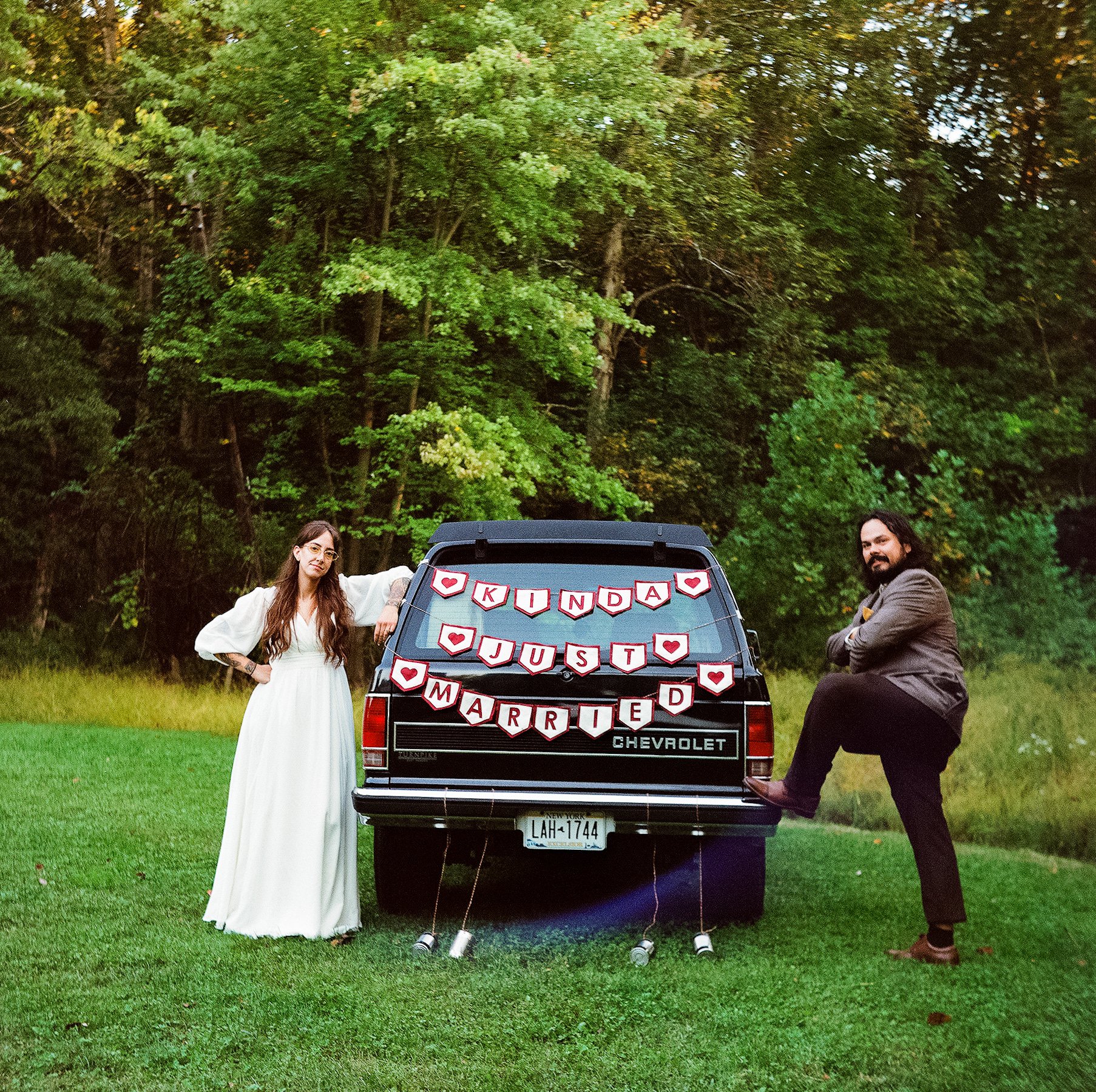 Fun elopement couple with Kinda Just Married truck on film