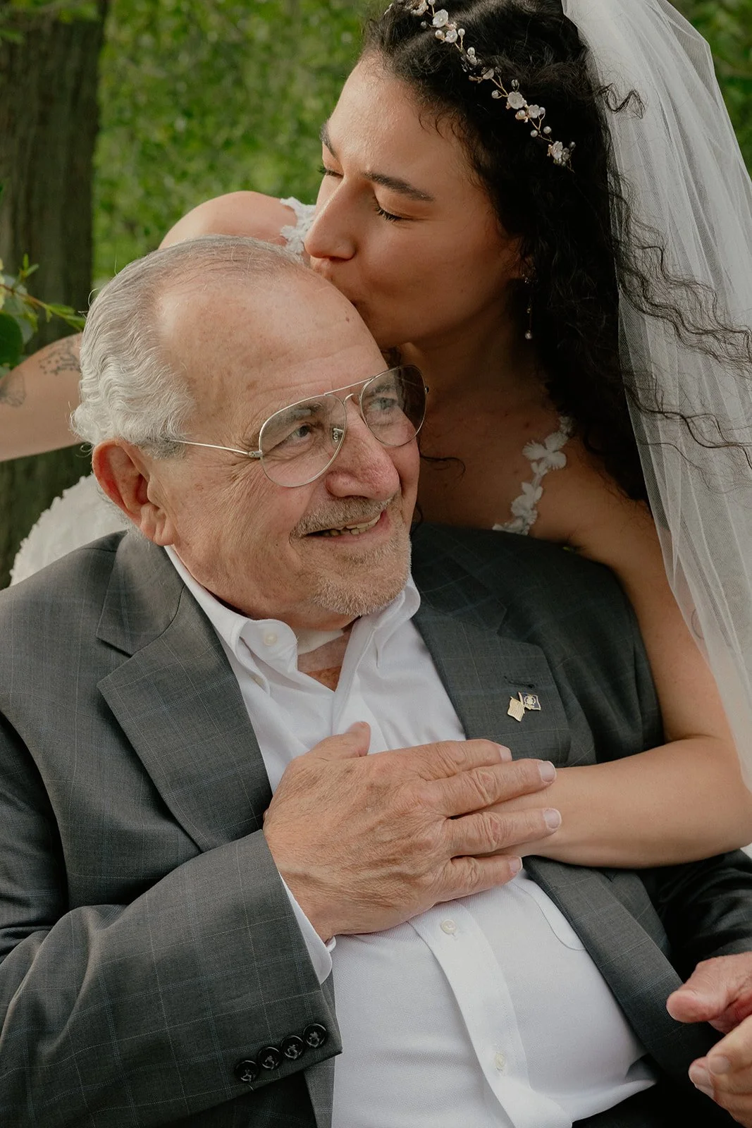 Bride kissing her grandfather, tender wedding portrait NYC