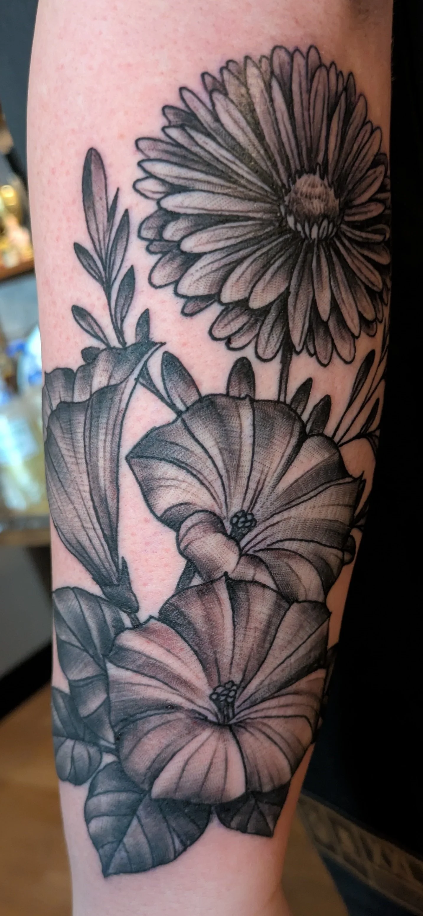 Black & Grey fineline flowers tattoo