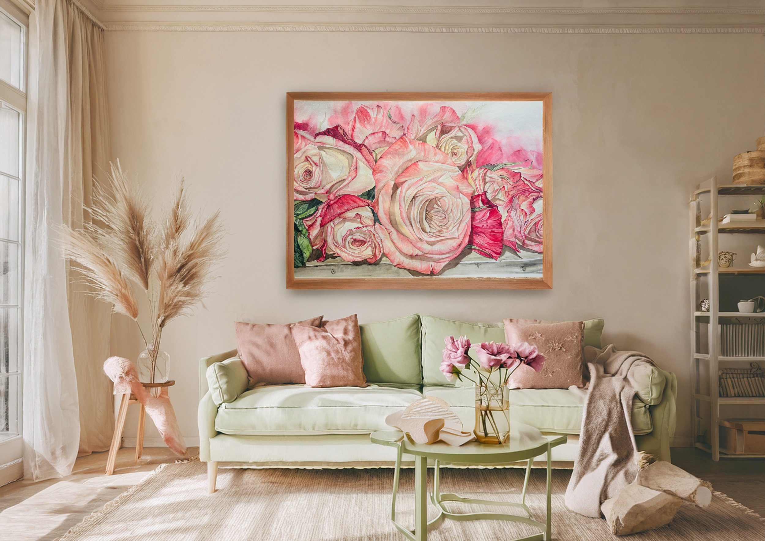 A living room featuring a white sofa with pink and beige pillows, a glass coffee table with flowers in a vase, a large floral painting on the wall, a plant with pampas grass in a vase, and sunlight coming through white curtains.
