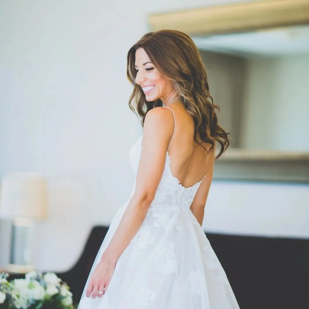 Natural bridal makeup with glowing skin and soft waves for a timeless wedding day look – Los Angeles wedding makeup.
