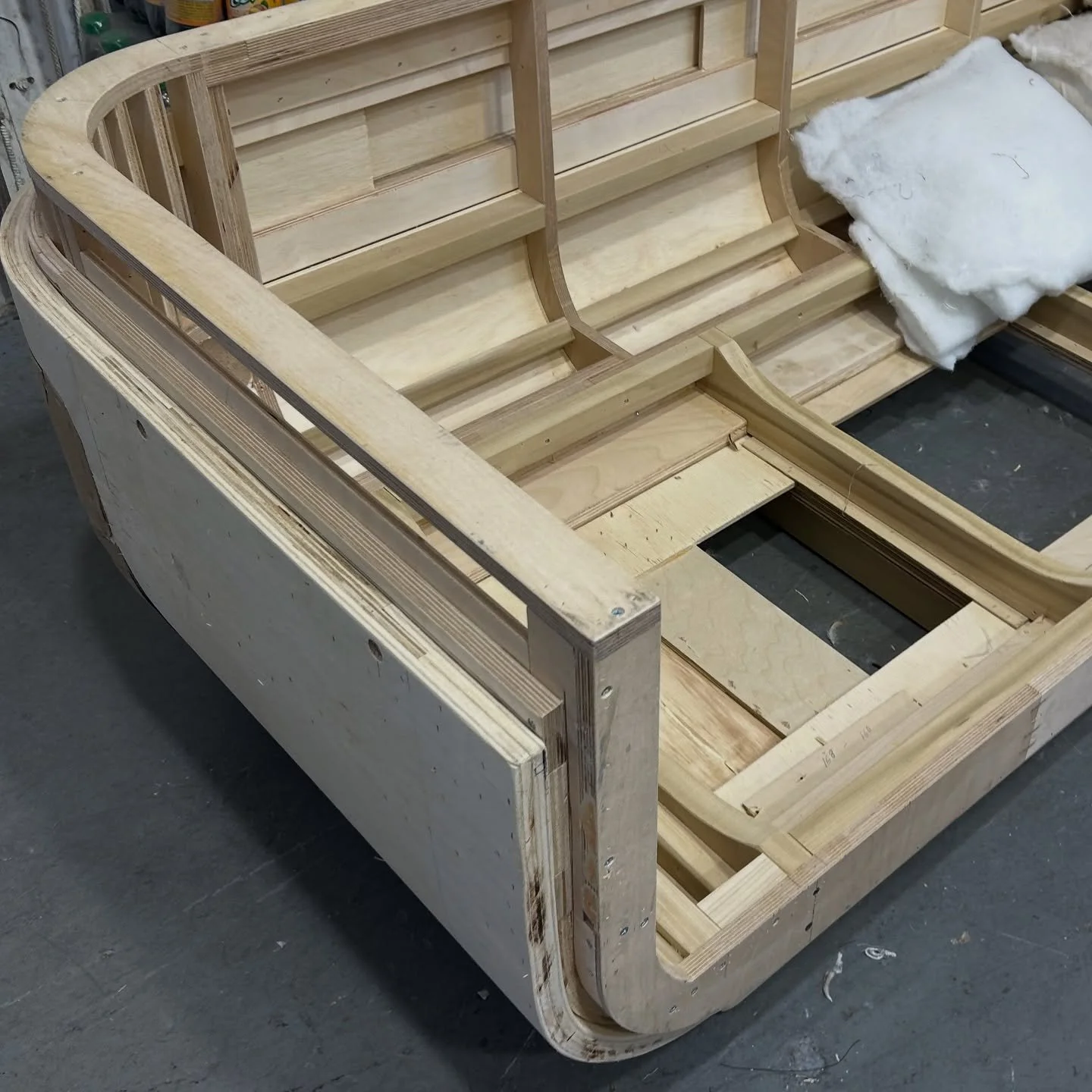 This is the frame structure of a custom curved sofa coming to life in our workshop. After refining the inspiration and drawings, the frame takes shape through expert craftsmanship. Next up: foam and upholstery. Who&rsquo;s ready to see the final piec