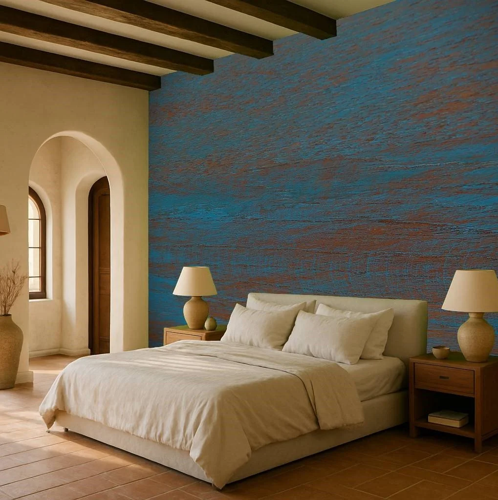 Textured blue bedroom wallpaper wall mural with layered artistic surface behind bed and arched windows – Pop Papel textured seamless wallcovering for bedrooms