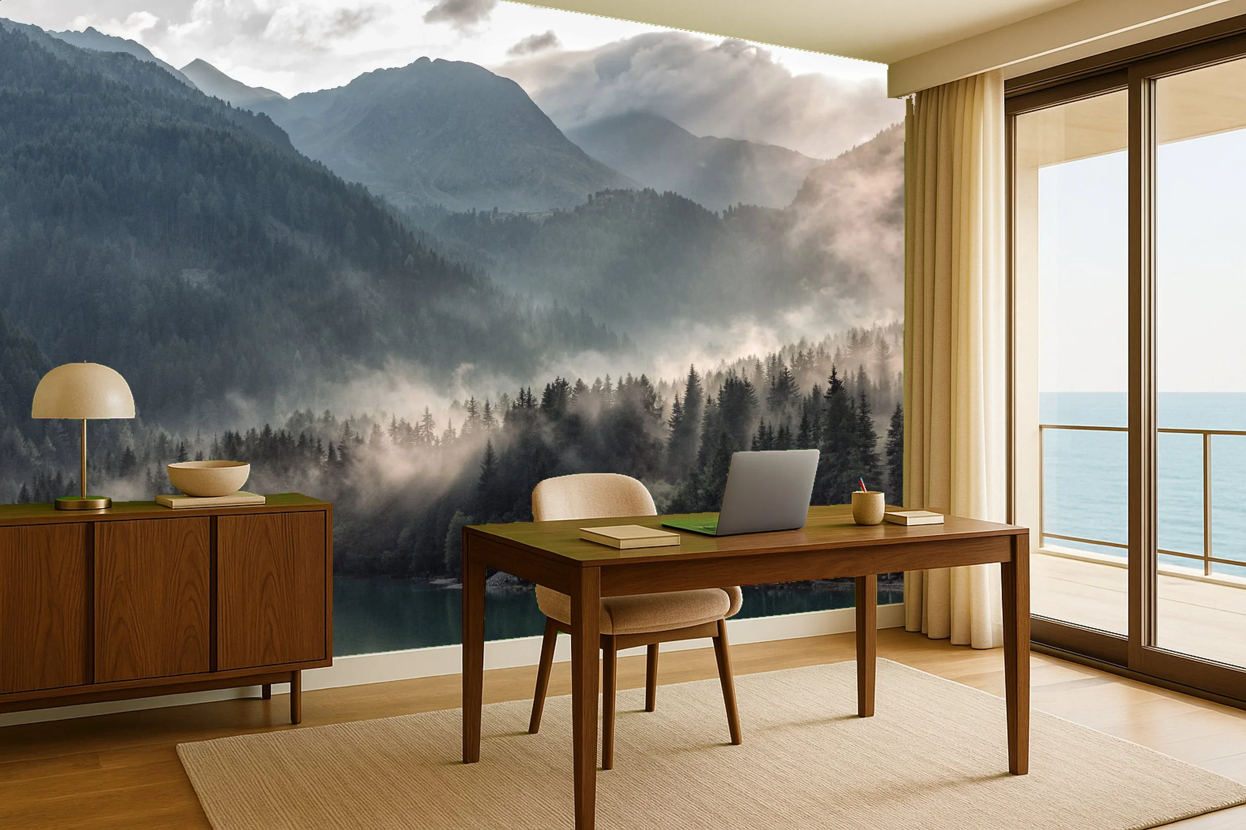A modern office space with a wooden desk, beige chair, laptop, books, and a window with a view of a mountain landscape and ocean.