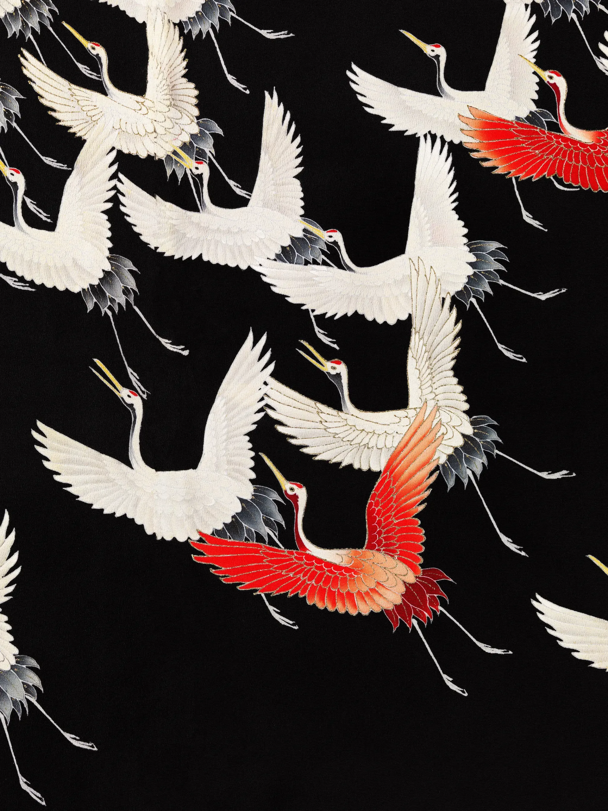 Pattern of flying cranes, mostly white with black and red accents, on a black background.