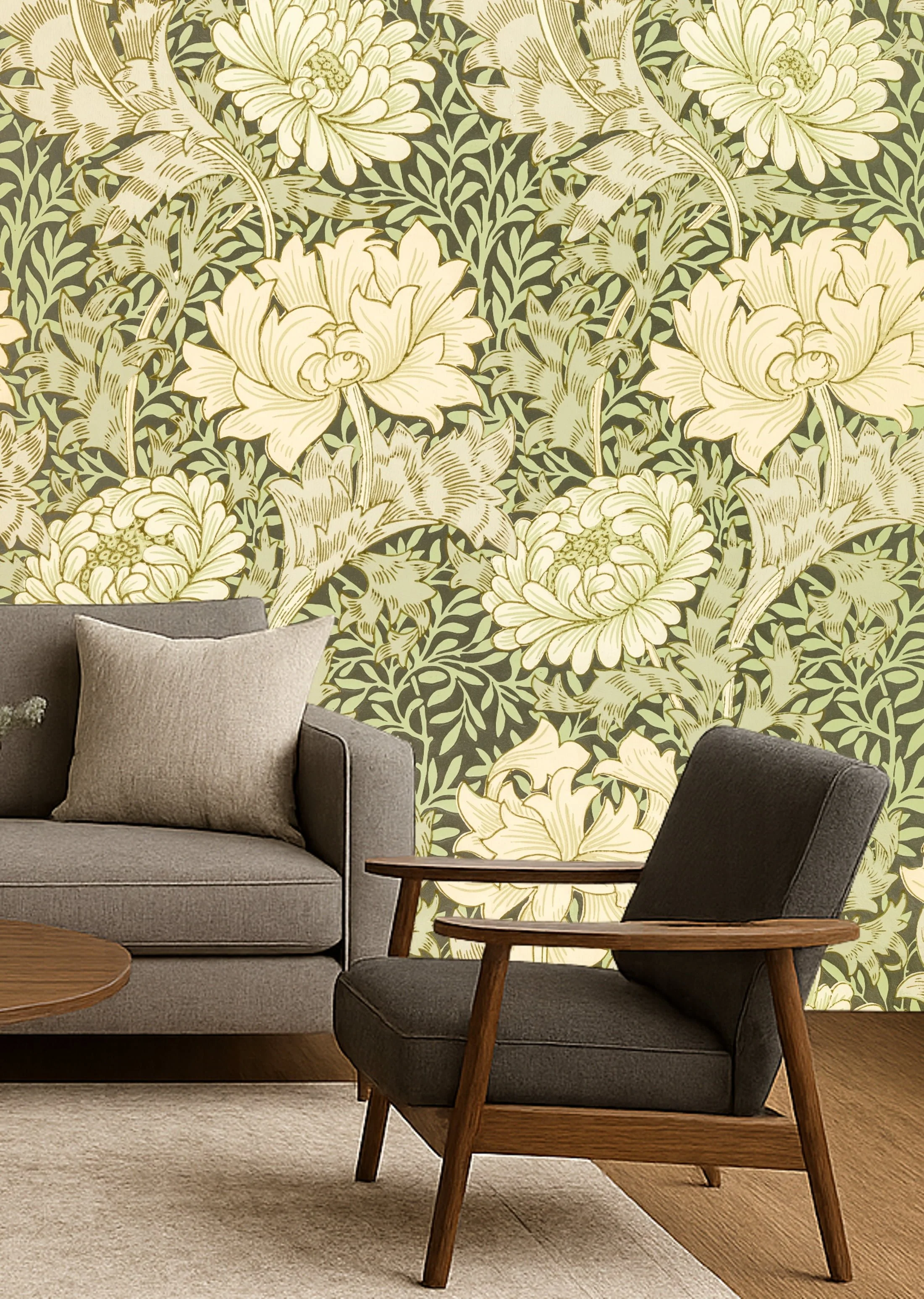 Green floral wallpaper wall mural with cream flowers and foliage behind modern armchair and sofa in living room – Pop Papel botanical seamless wallcovering