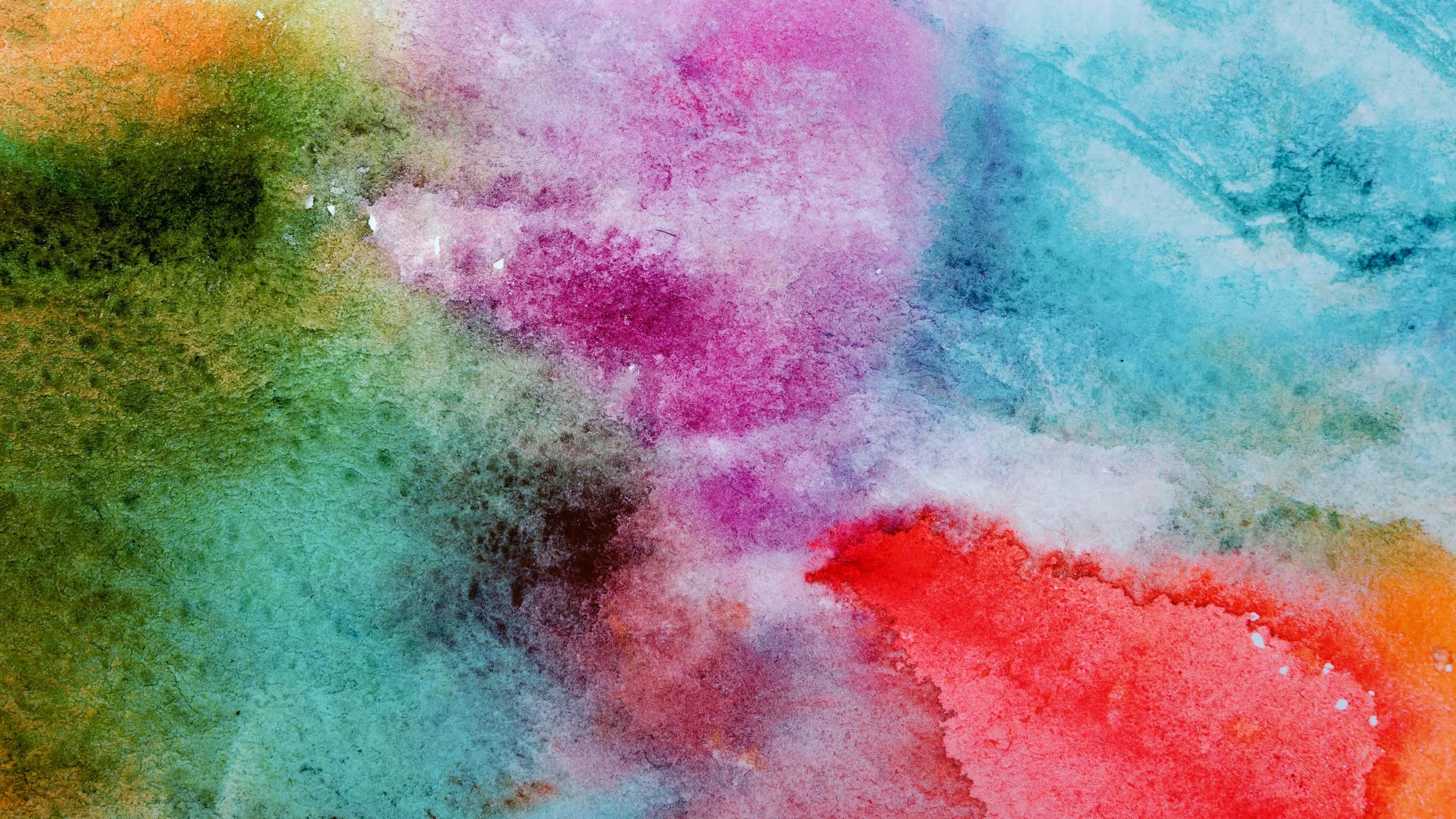 Abstract watercolor painting with vibrant splashes of green, pink, red, blue, and yellow colors blending together.
