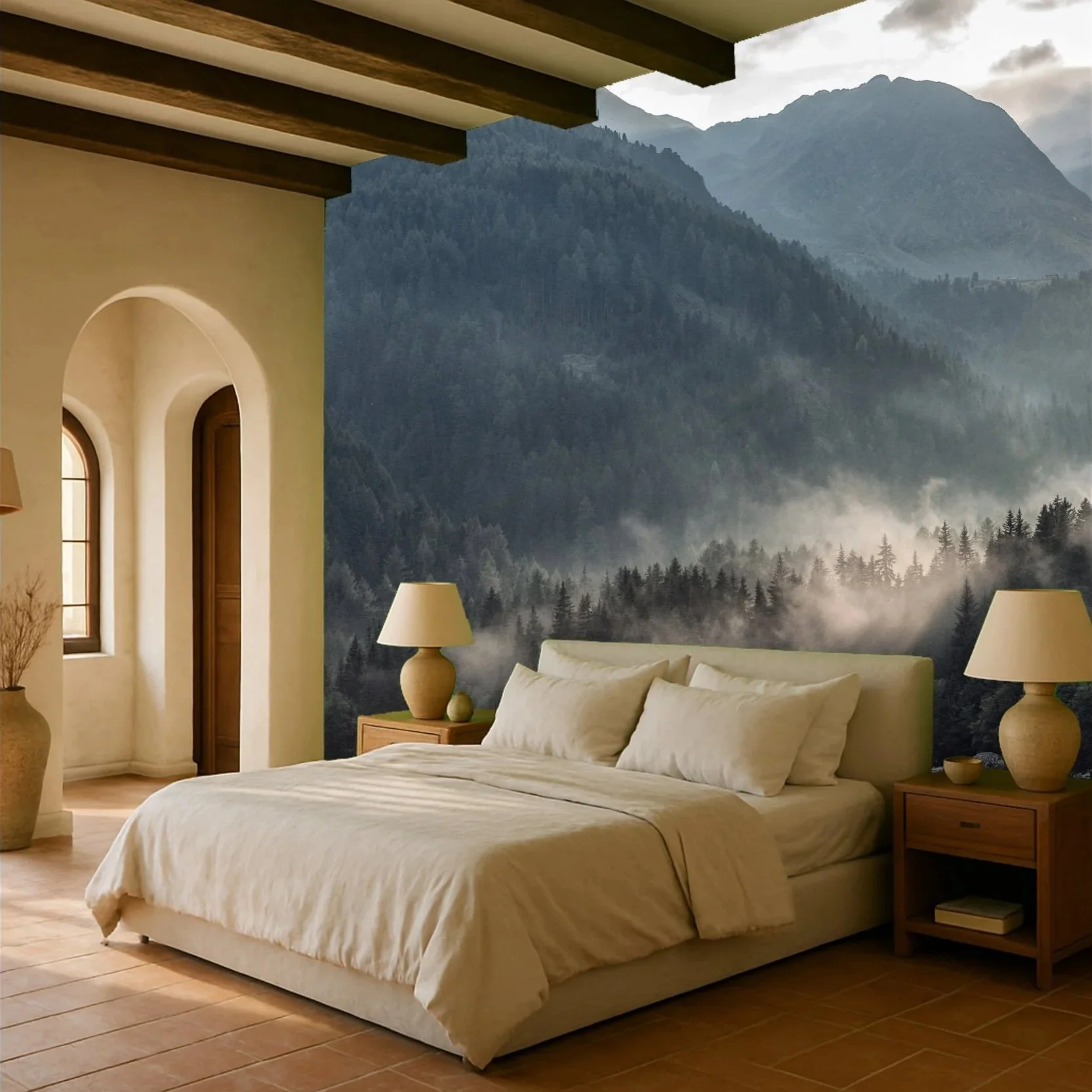 A cozy bedroom with a large bed, two bedside tables with lamps, and a mountain forest mural on the wall behind the bed.