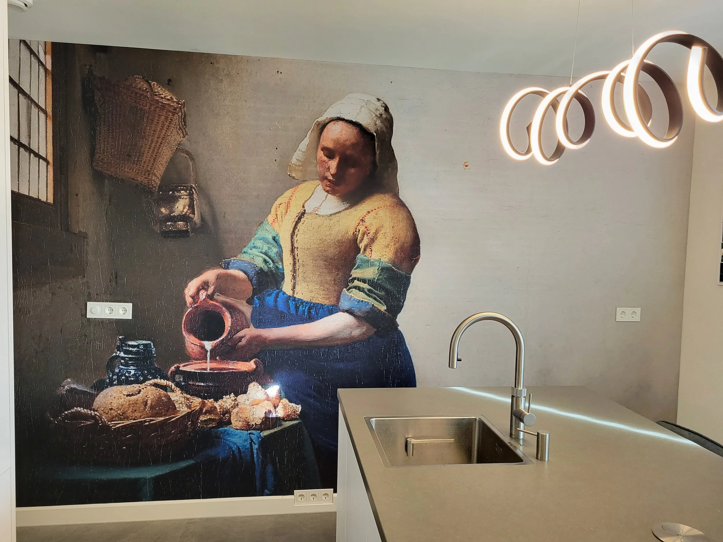 Artistic bathroom wall mural wallpaper featuring expressive portrait artwork behind modern sink – Pop Papel custom seamless wallcovering completed project