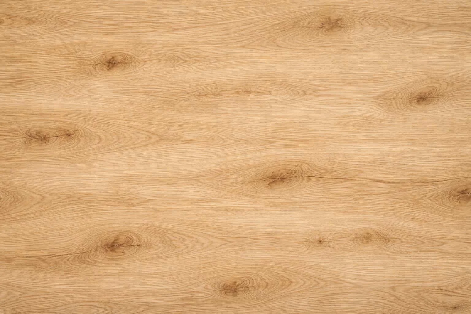 Light-colored wooden surface with visible wood grain and knots.