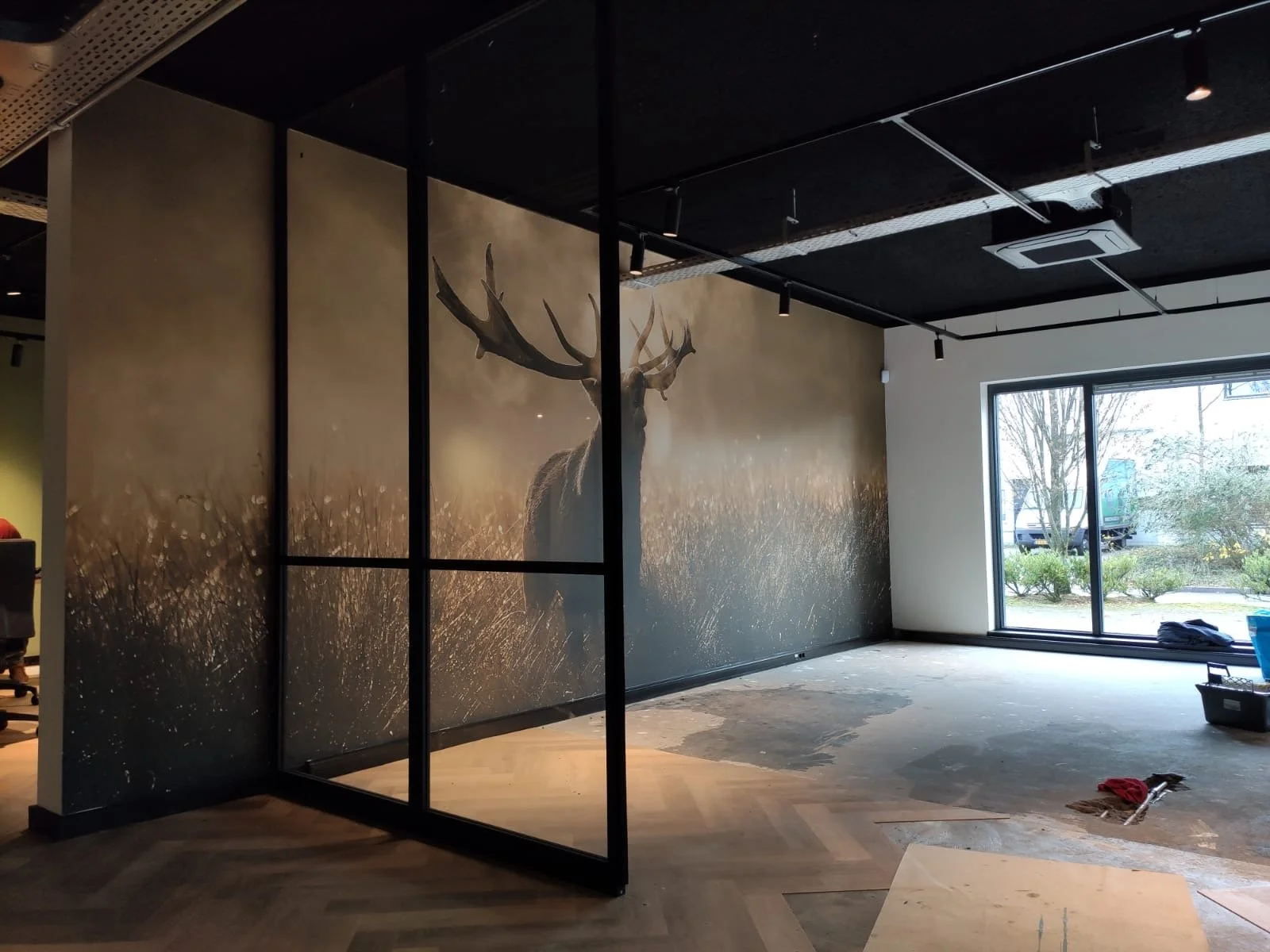 Large-scale abstract wall mural wallpaper installed across modern open-plan interior – Pop Papel bespoke seamless wallcovering completed project