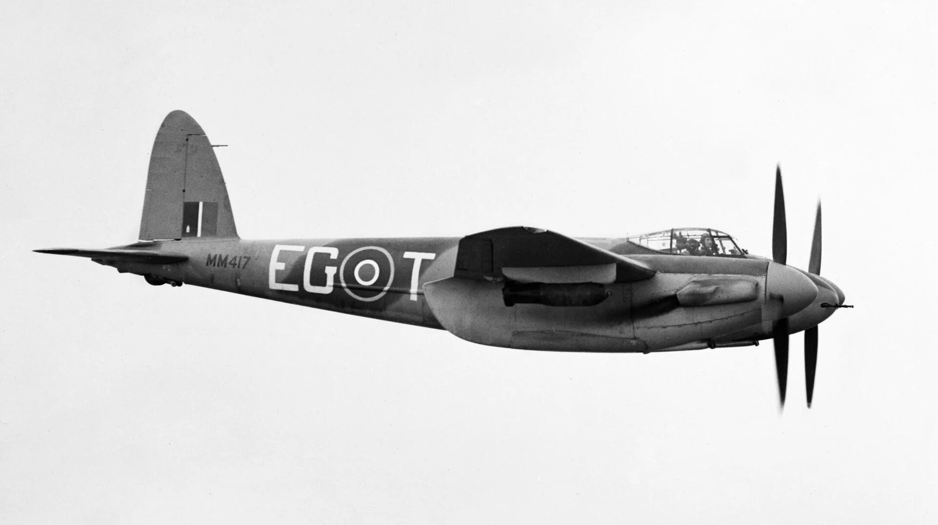 A de Havilland Mosquito FB Mk VI in flight, side profile, RAF squadron codes EG-T and serial MM417 visible on the fuselage.