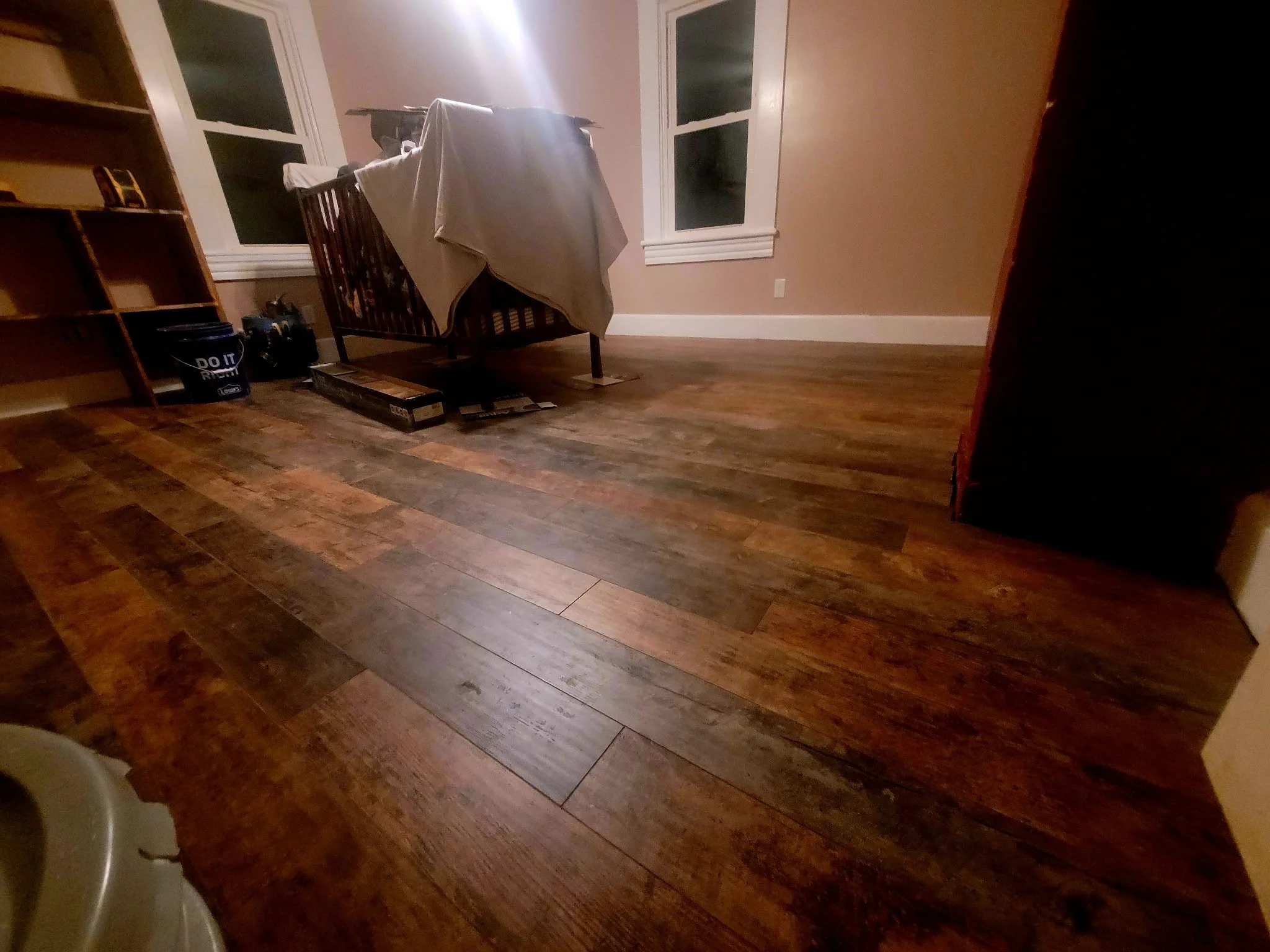 Waterproof laminate flooring installed in a residential space by a professional flooring installer in the Greensboro Triad area