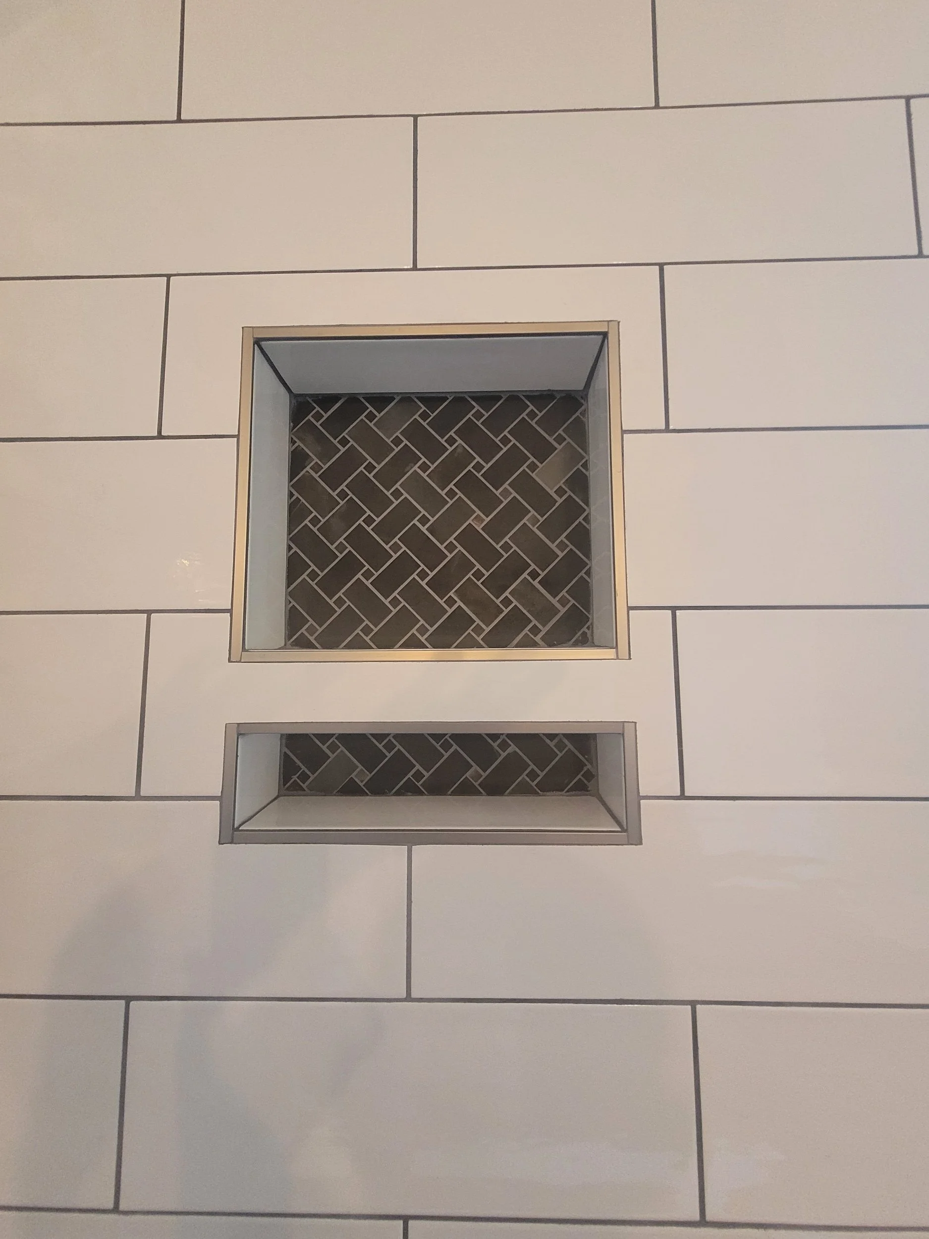 Custom shower niche with mosaic tile detail in Greensboro NC