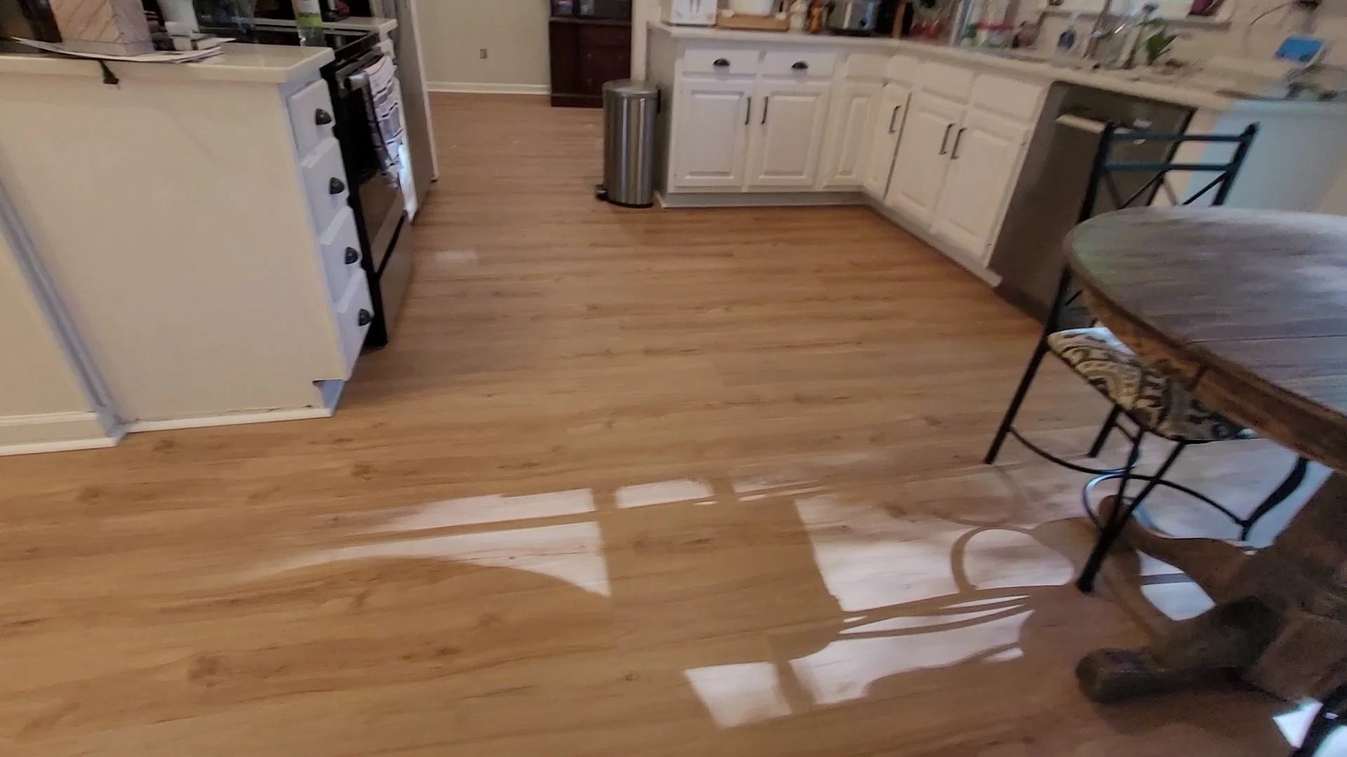 Laminate flooring installation in a residential home by a local flooring contractor serving Greensboro and Browns Summit, North Carolina
