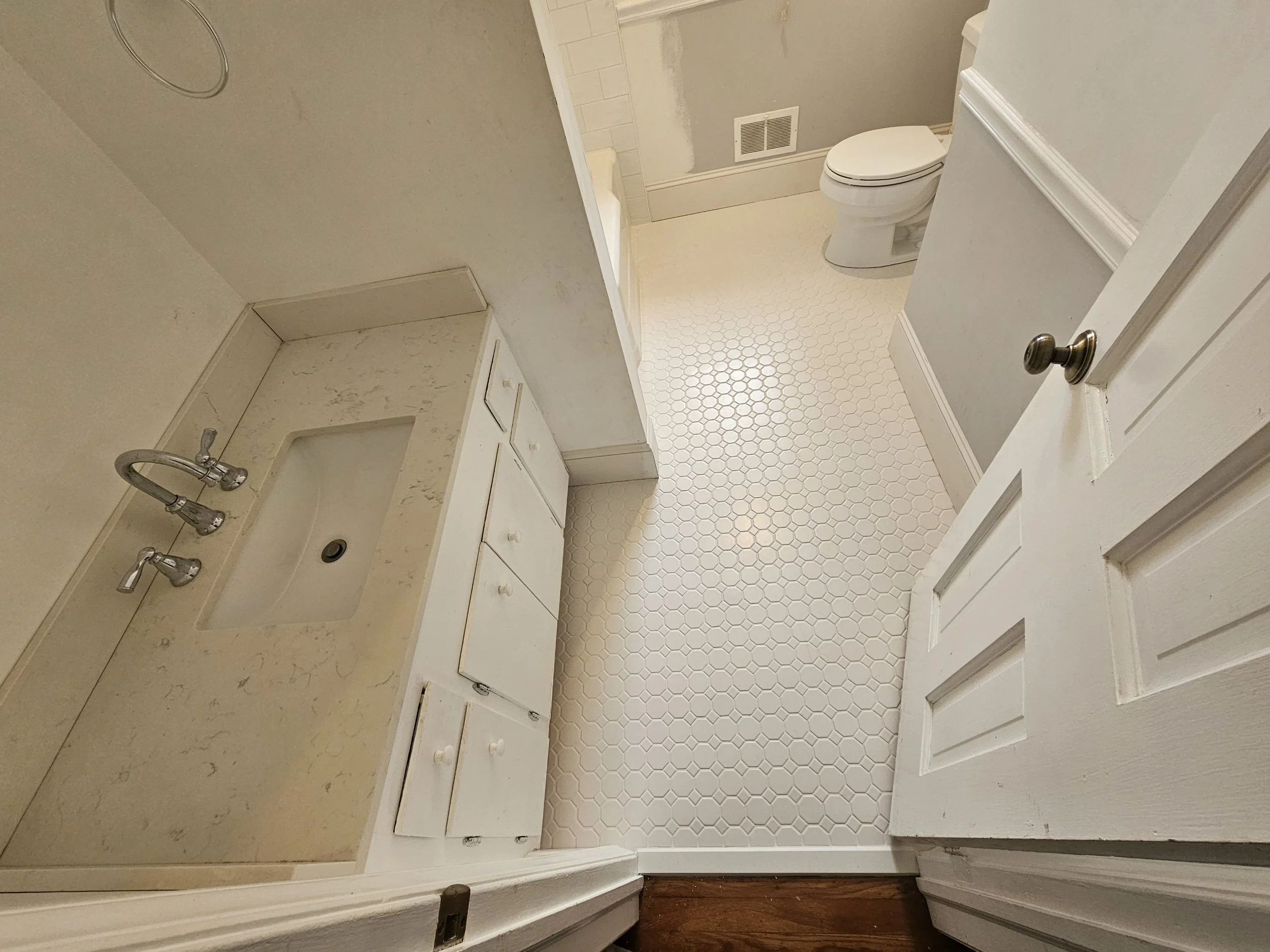 Bathroom remodel with custom tile flooring and double vanity in Greensboro NC