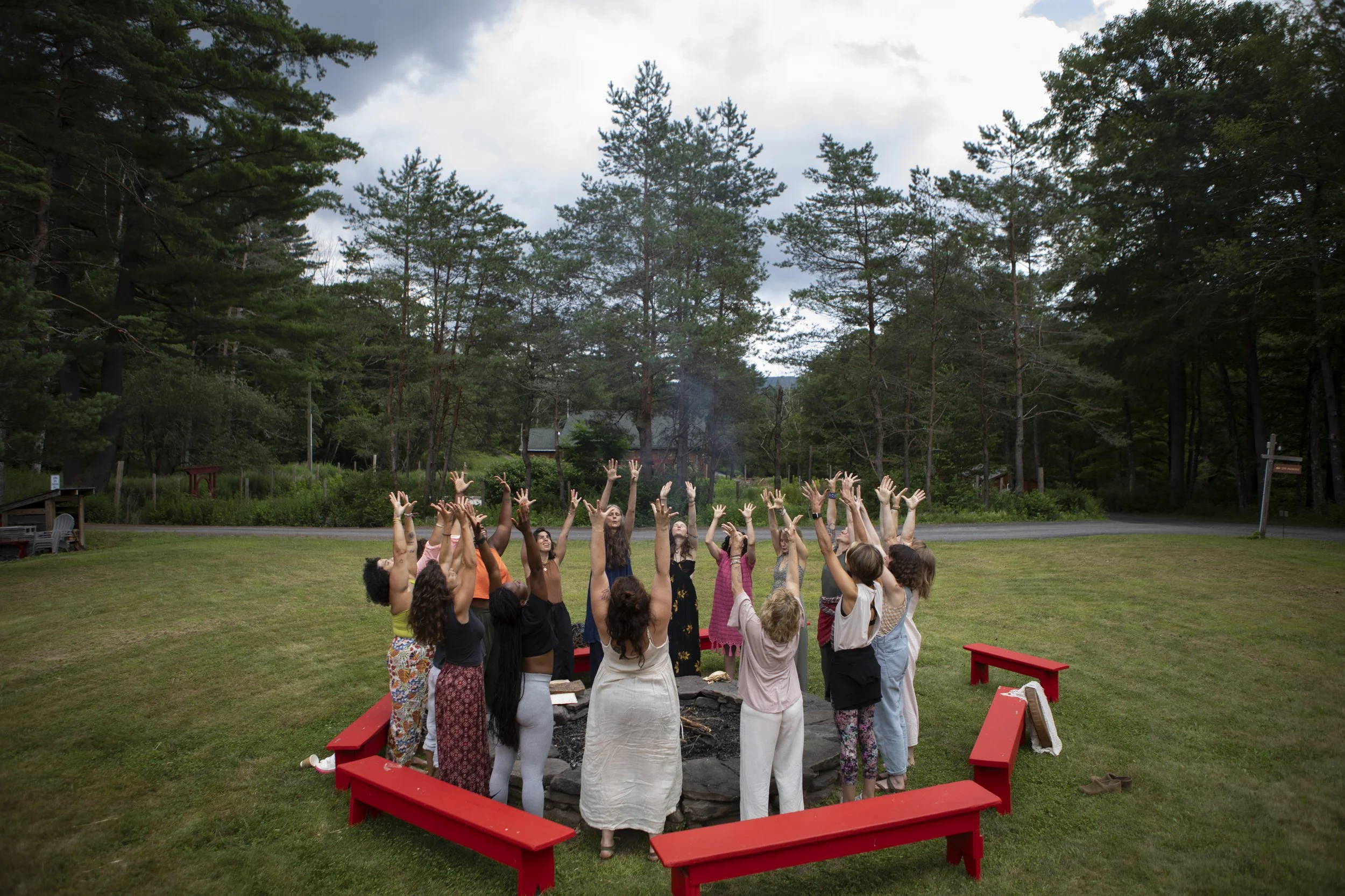 Women gathered in a healing circle during a spiritual retreat focused on emotional and embodied healing