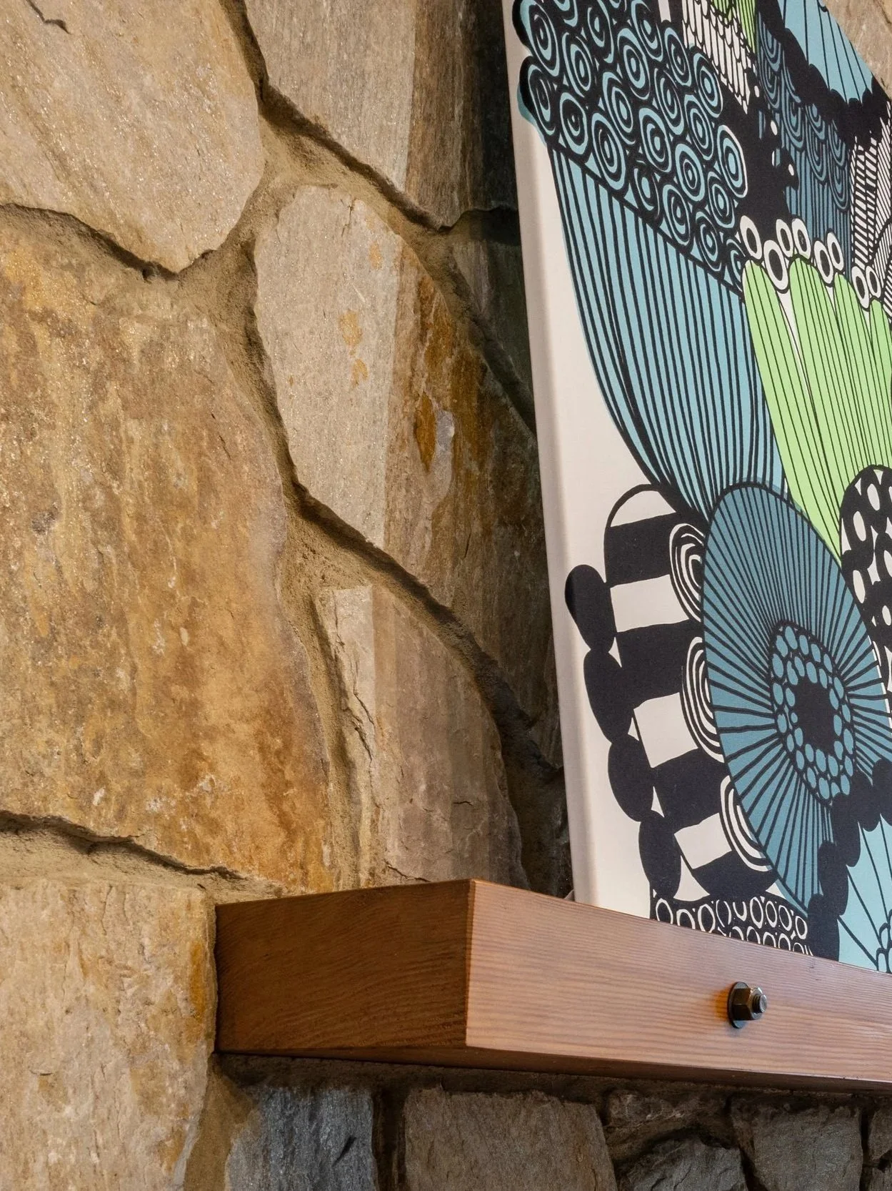 Mid-century modern architectural detail with wood trim and fieldstone wall inside New Jersey filming location.