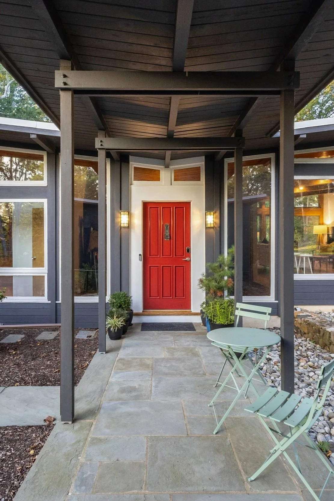 Mid-century modern front entry film location with covered porch, wood support beams, and architectural details suited for exterior scenes.