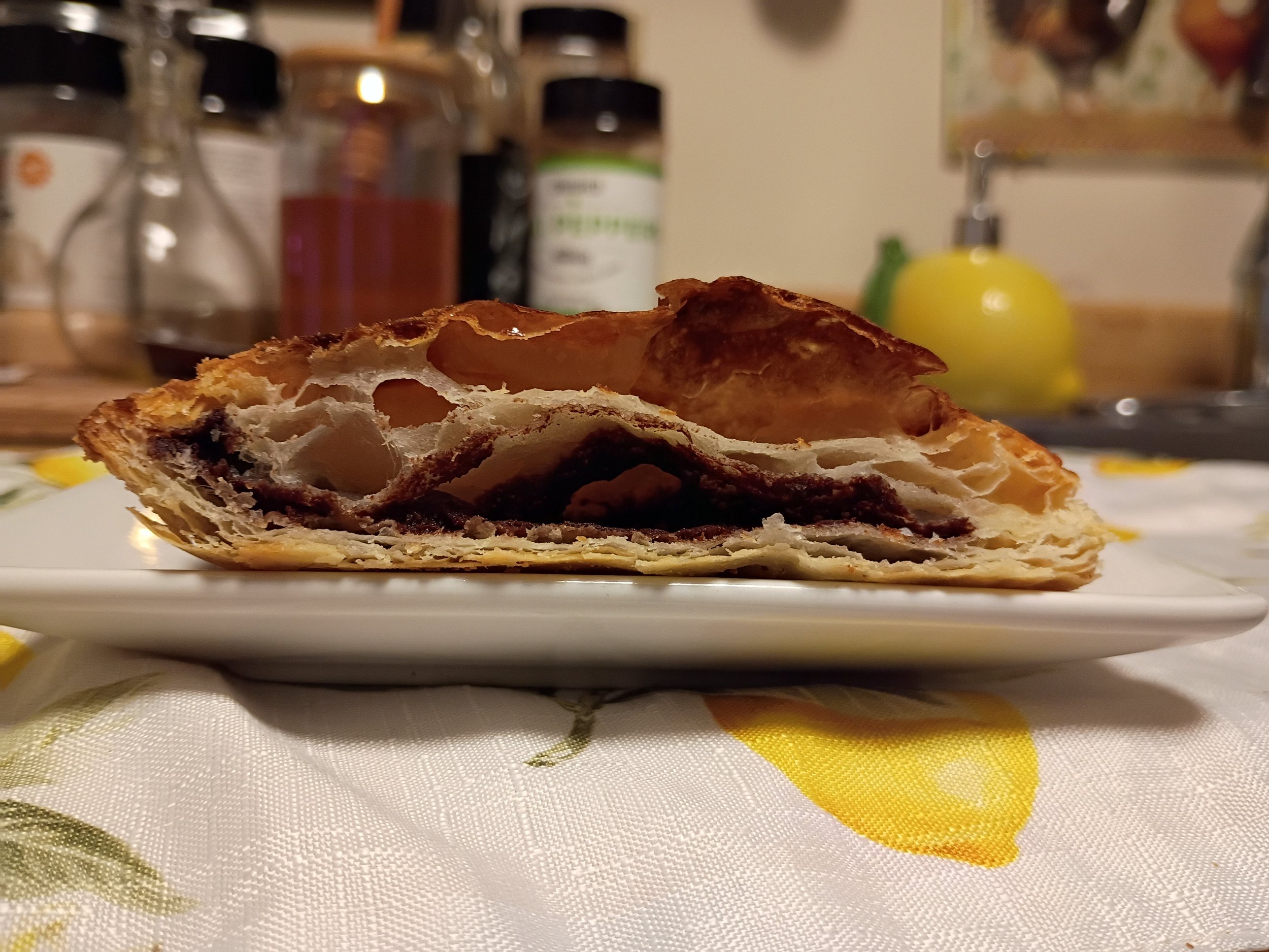 strudel cut in half to show flaky layers and filling