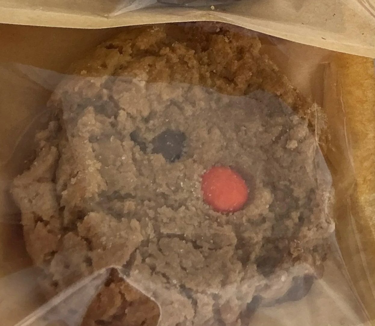 Peanut butter cookie with candy pieces shown