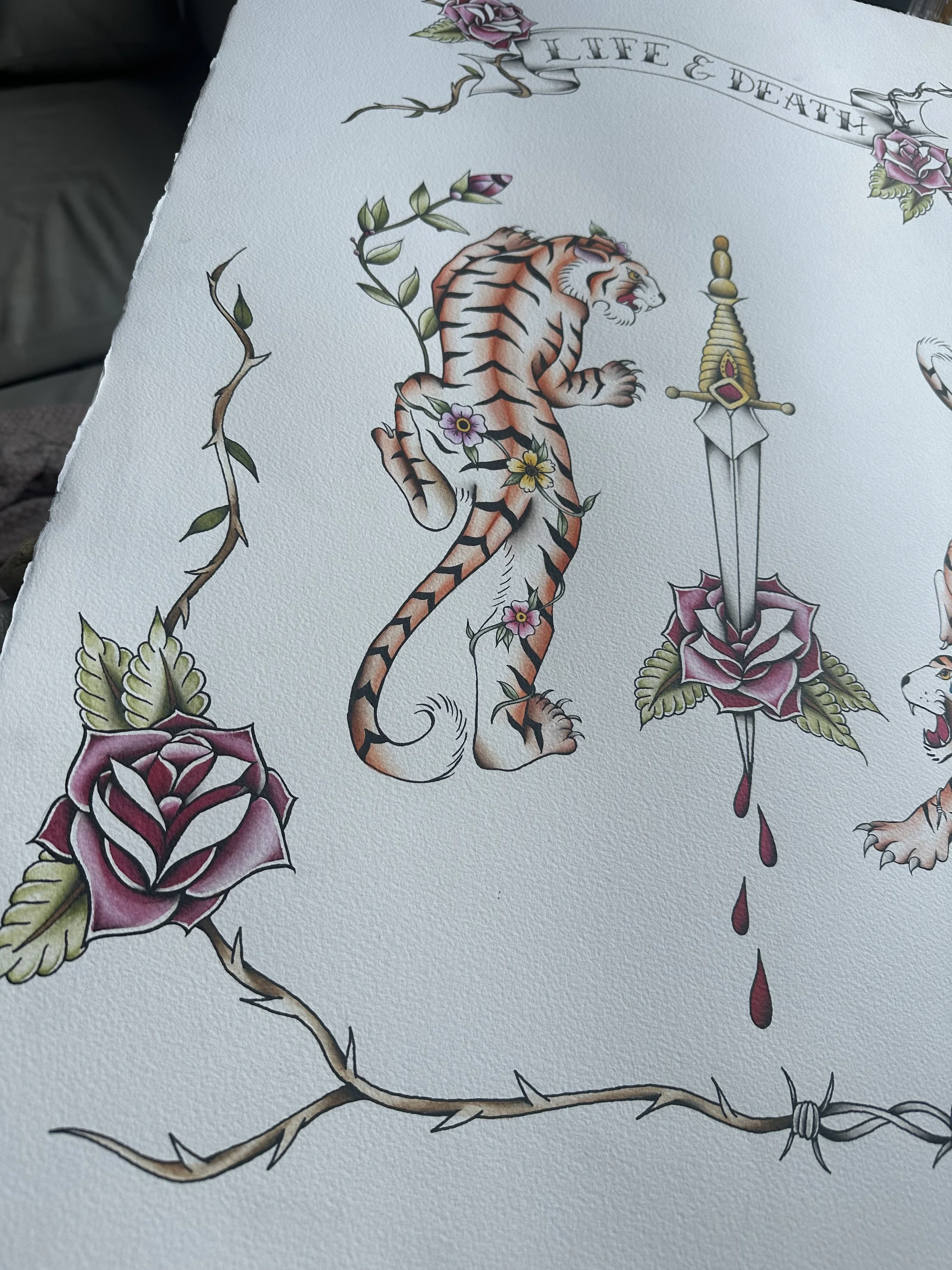 Tattoo design featuring a tiger surrounded by roses, with a sword dripping blood and the words 'Life & Death' at the top.