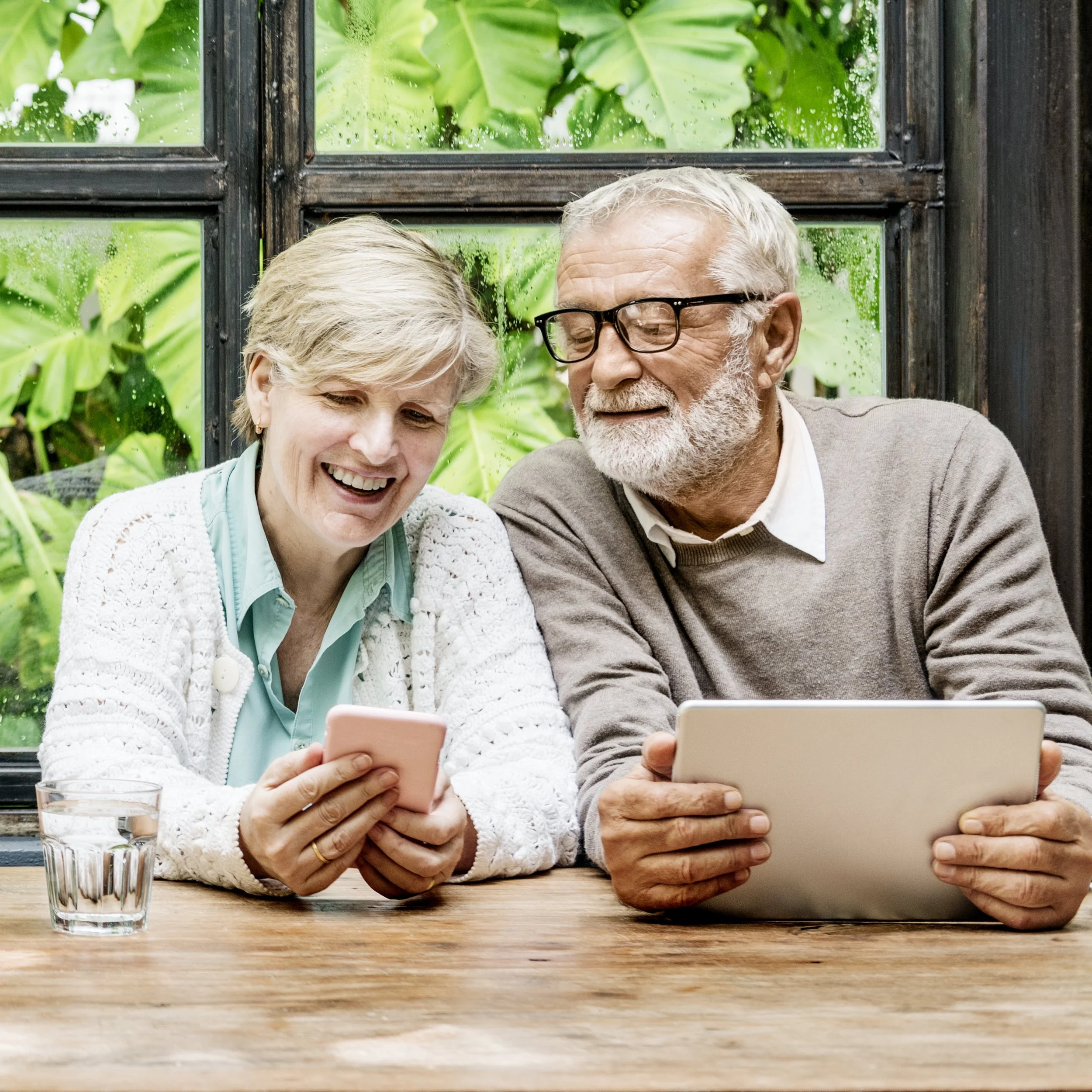Couple using a digital device at home
