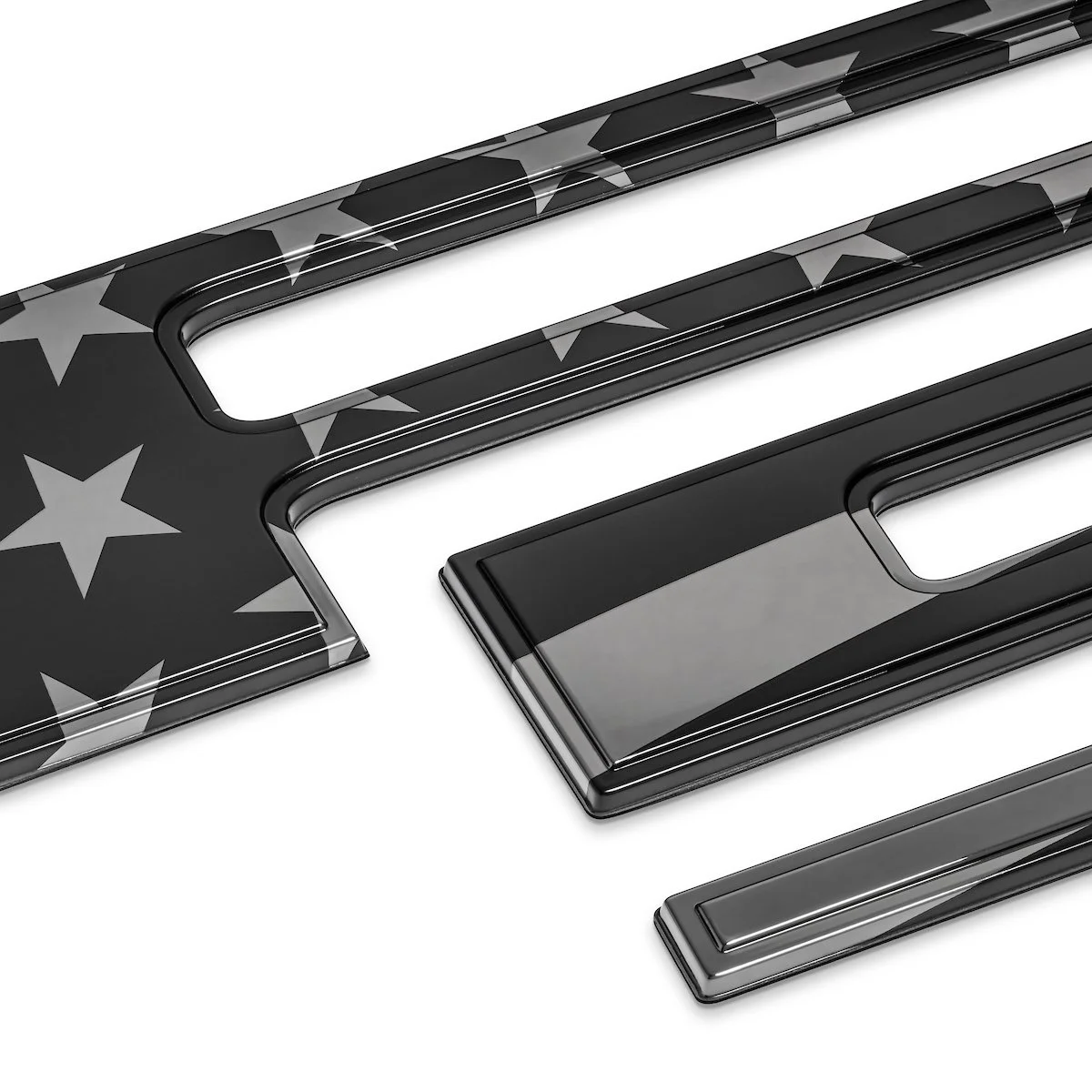 Close-up of black metallic American flag-themed objects with stars and stripes design.