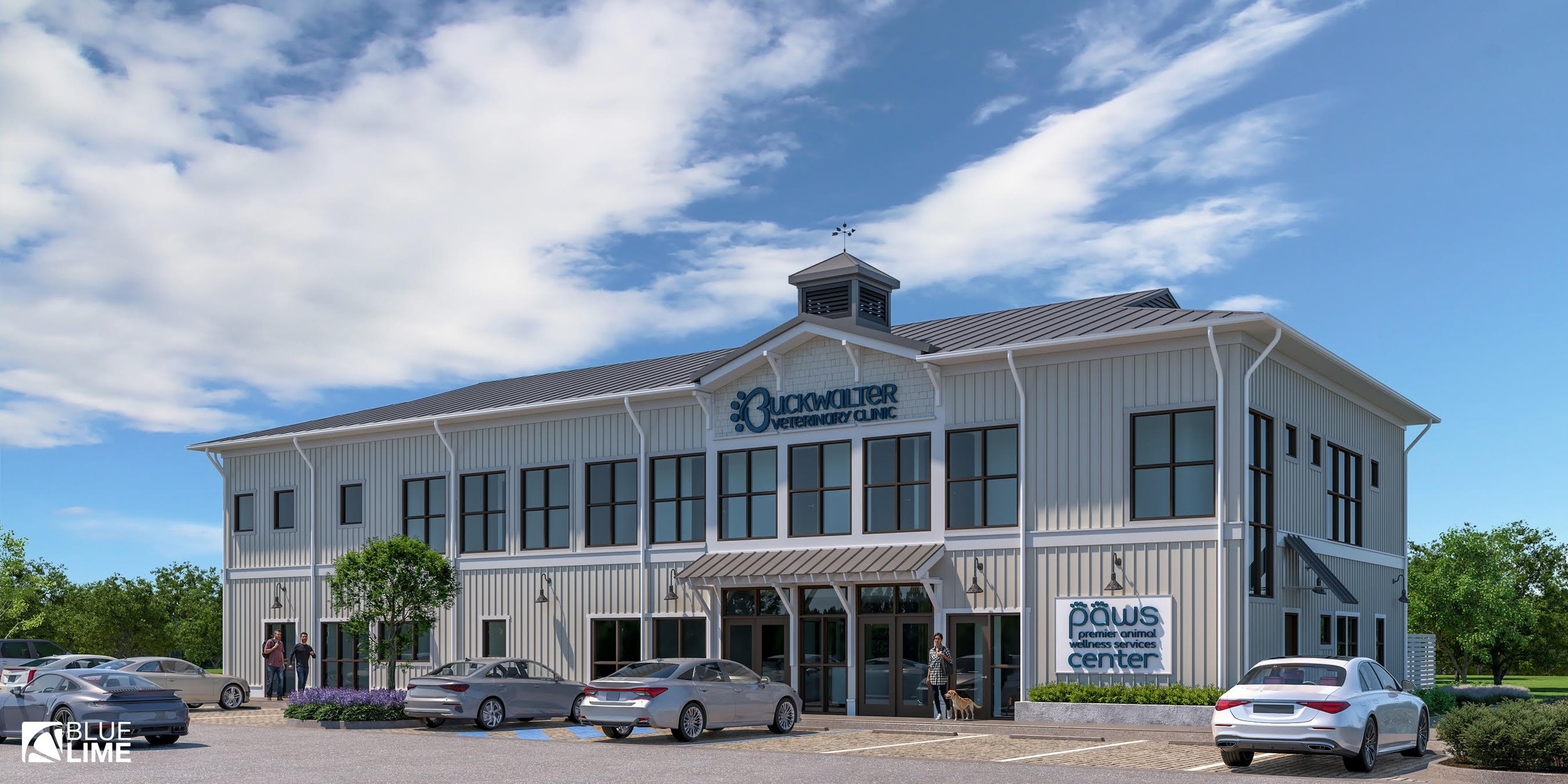 A modern, two-story veterinary clinic building named Buckwalter Veterinary Clinic and Paw's Premier Animal Wellness Services Center with a parking lot and four cars in front, some people and a dog near the entrance, trees, and a blue sky with clouds.