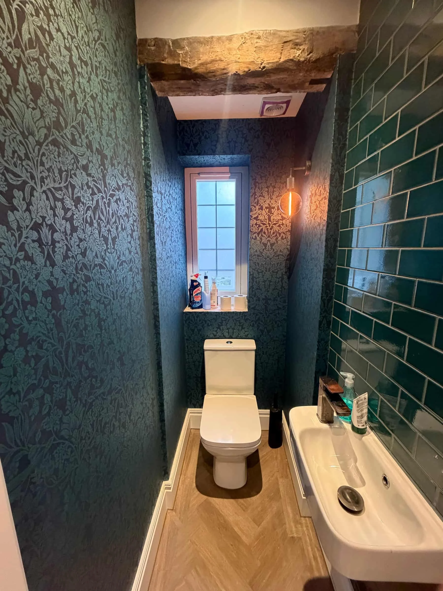Blue patterned wallpaper installation in a bathroom in Harpenden, Hertfordshire