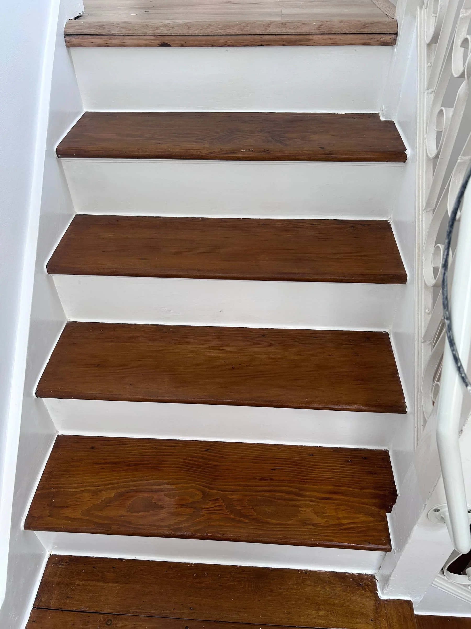 Painted white staircase with restored timber treads in Harpenden, Hertfordshire