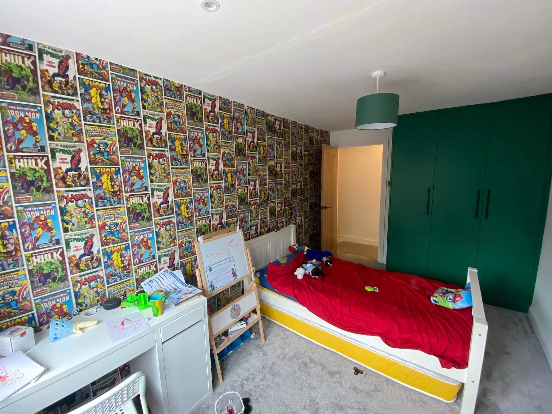 Comic book wallpaper installation in a child's bedroom in Stevenage, Hertfordshire
