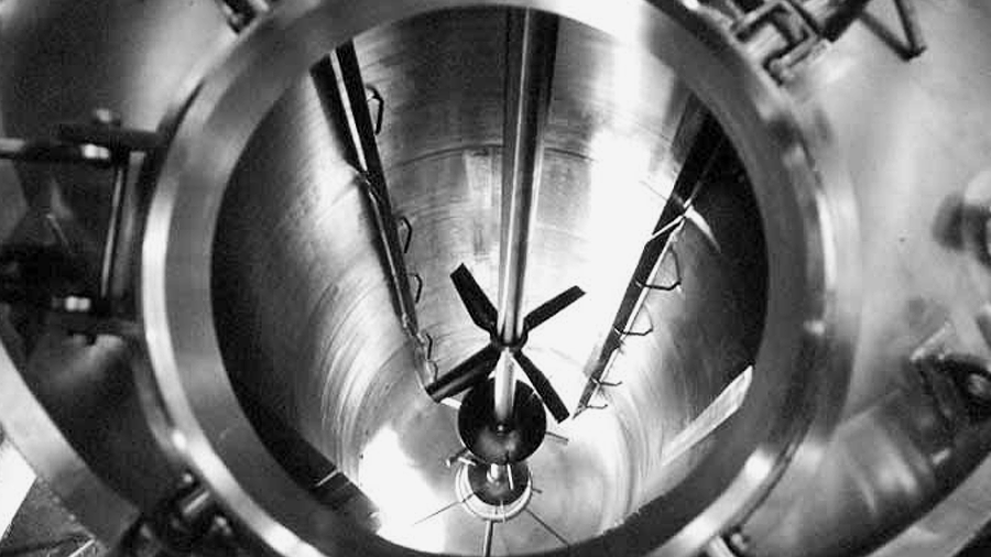 Inside view of a rocket engine's combustion chamber, with a clock superimposed, showing the time at 3:15.