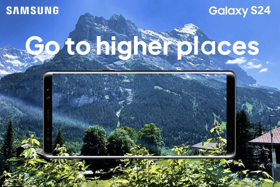 A promotional image for the Samsung Galaxy S24 smartphone featuring a scenic mountain landscape with greenery, trees, and snow-capped peaks displayed on the phone's screen and in the background.