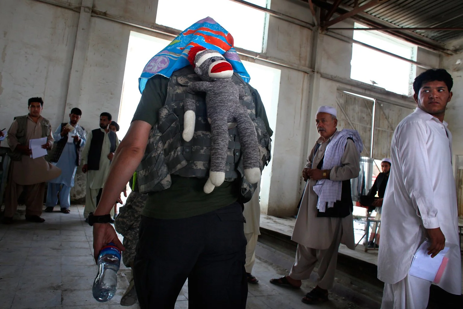 Amy Bursell carries ‘Mission Monkey’ to lighten the mood in Afghanistan. As a social scientist with the Human Terrain System, she works to understand the local population. ‘The military has the brains to do this work,’ she says, ‘but not the bodies.’