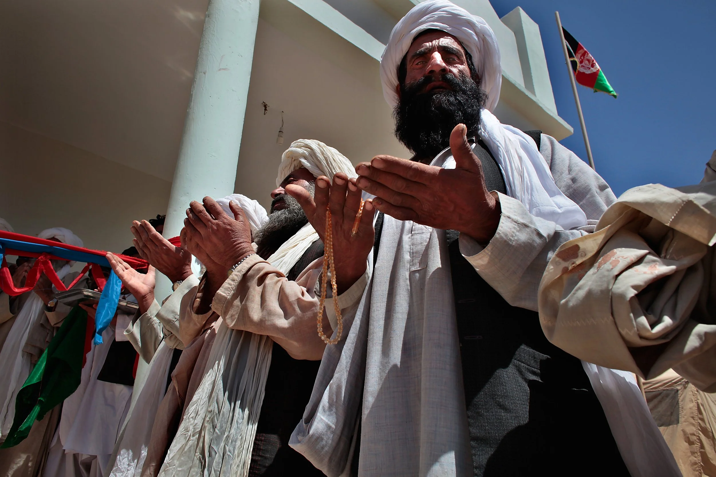 Marjah’s elders pray during the dedication of a new government center. Religion and politics are one and the same in Afghanistan, where no law can be passed that’s contrary to Islam. It’s one of the many cultural idiosyncrasies that make the country