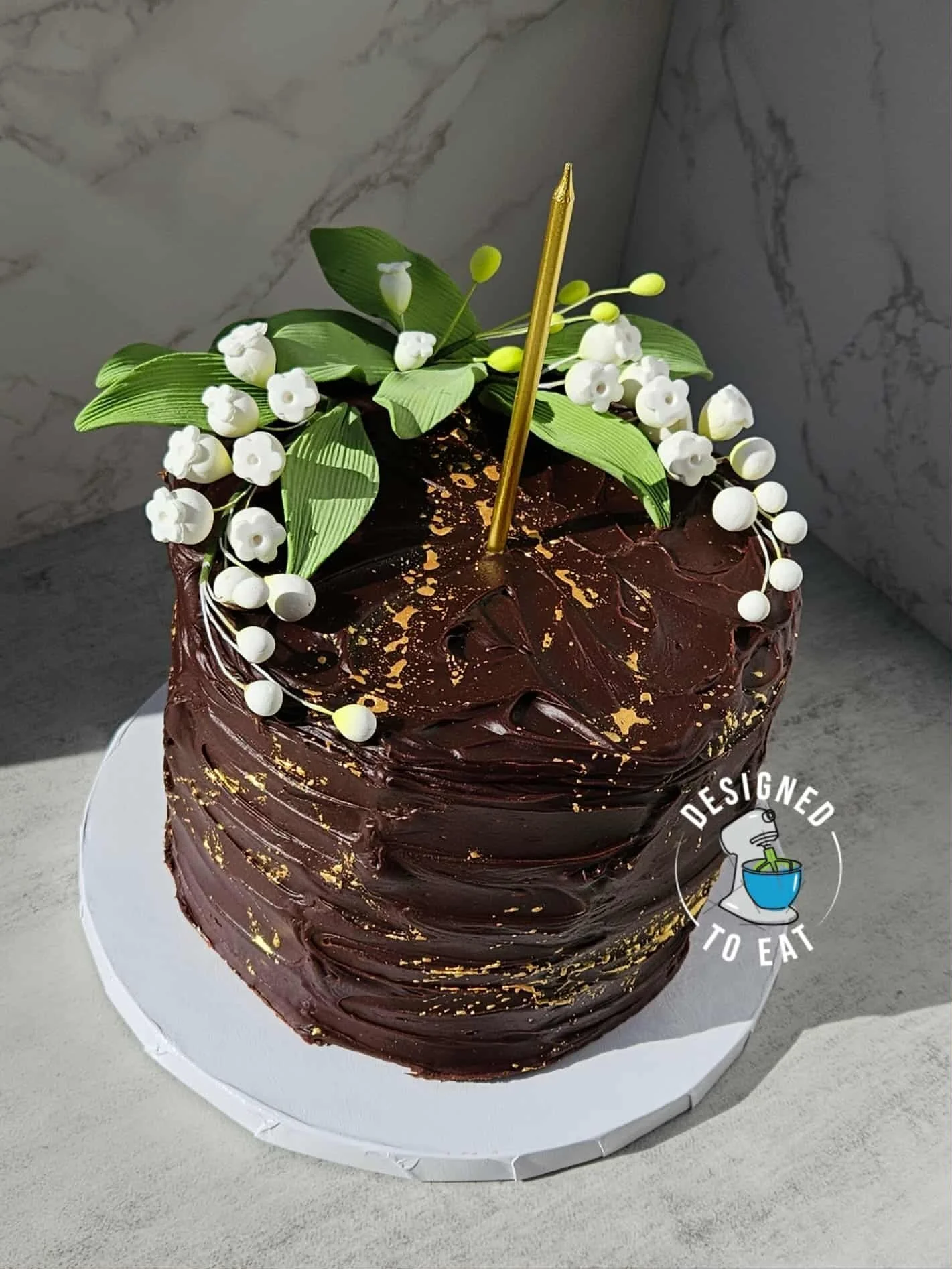 chocolate cake with white flowers
