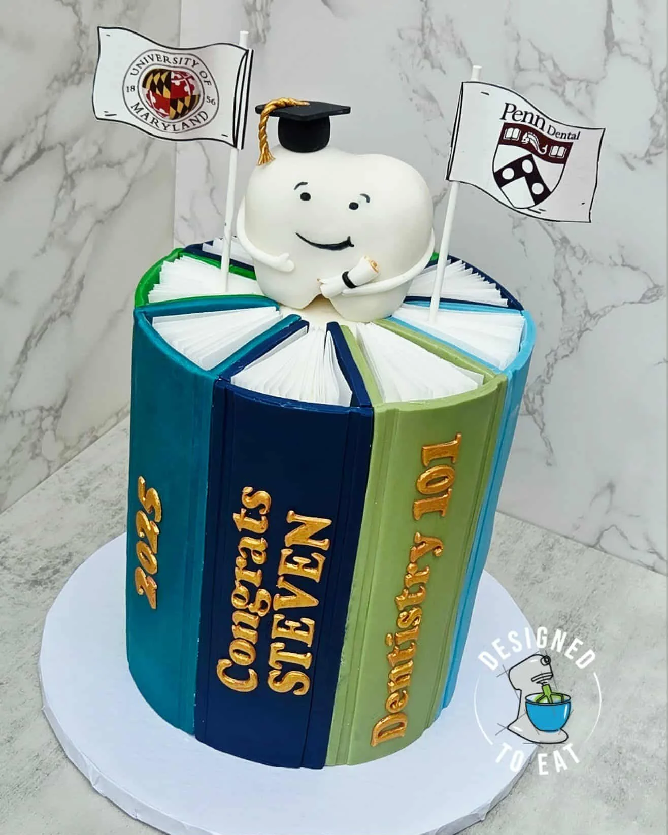 Dental School Graduation Cake that looks like books with a tooth on top