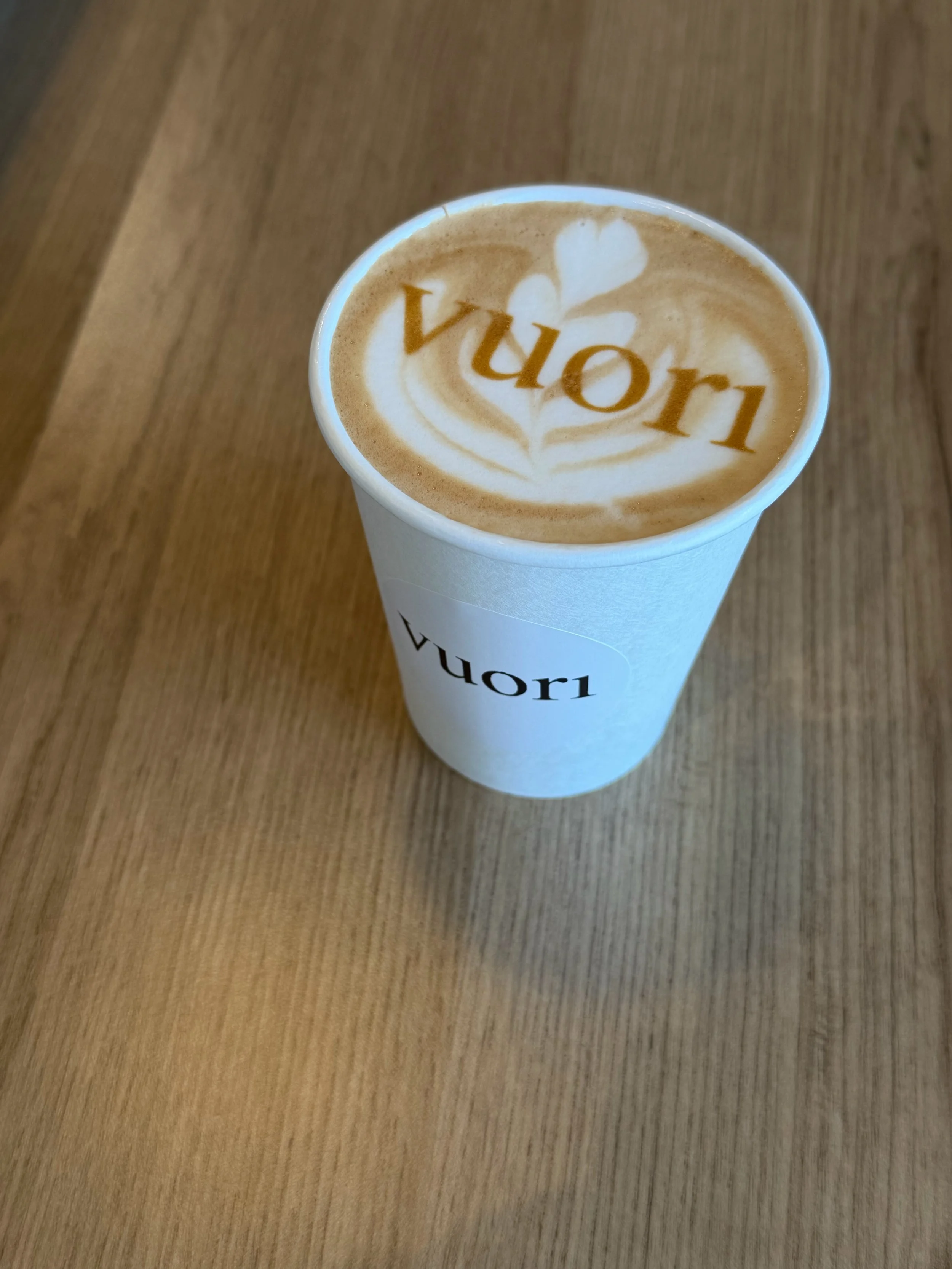 Latte art with Vuori logo served at a brand activation coffee catering event in LA