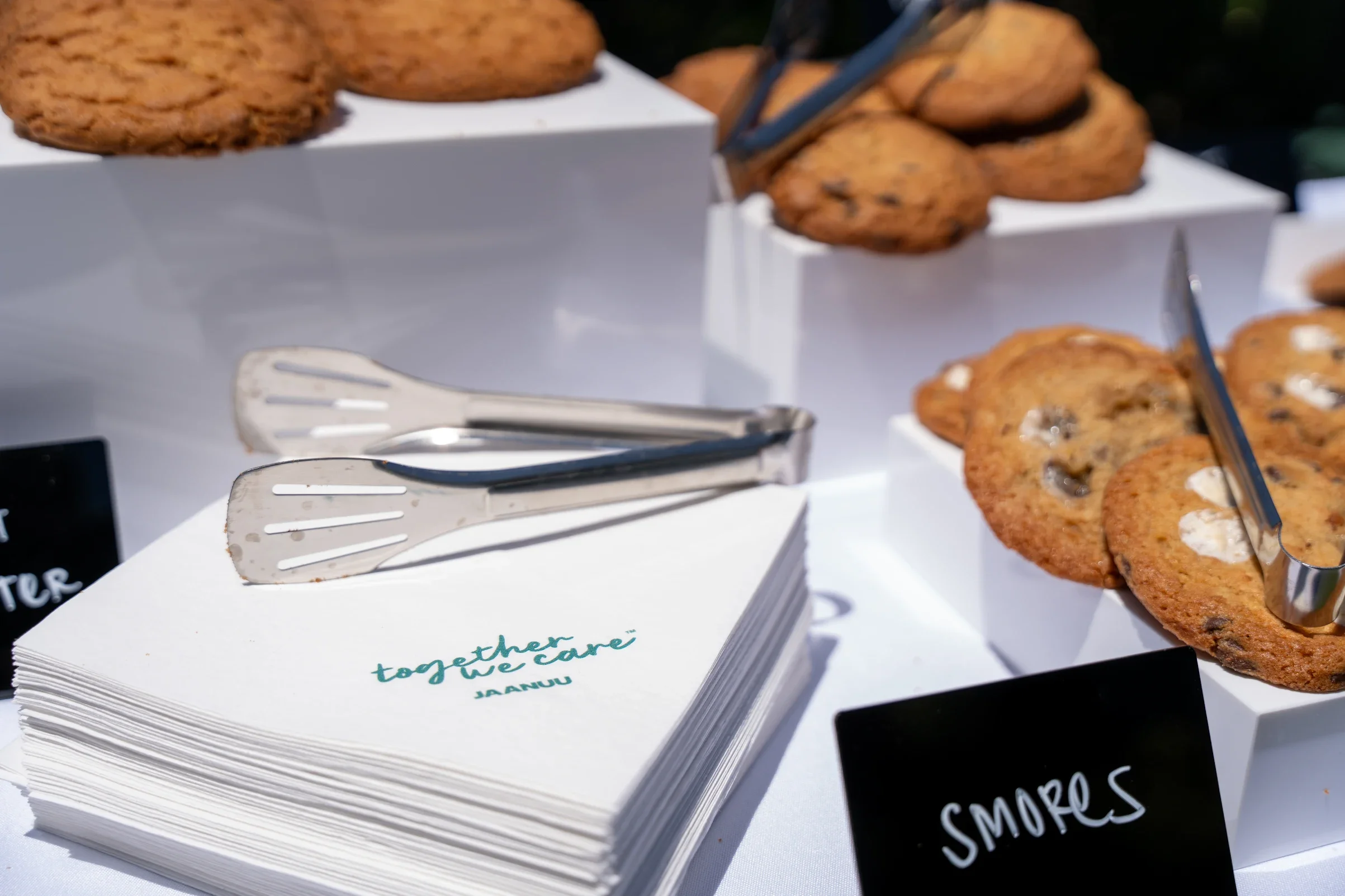 Branded JAANUU napkins and cookie smores table at Pulo Coffee Nurses Week 2026 brand activation in Los Angeles