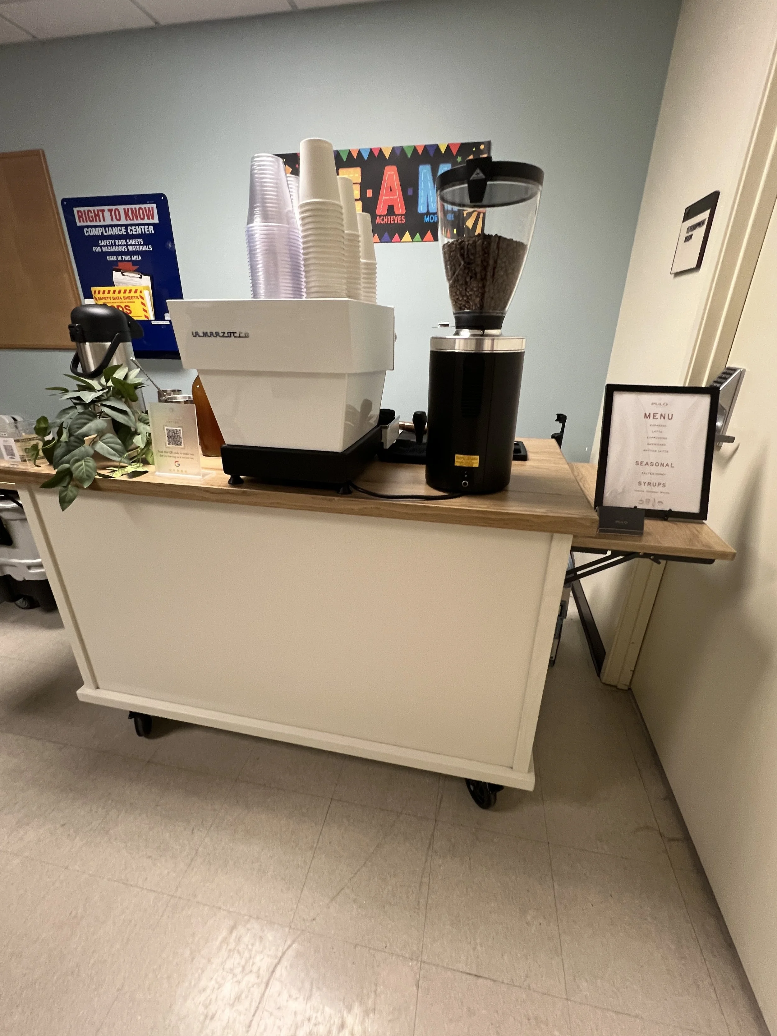 Coffee cart set up inside an office during a client appreciation experience for employees and guests