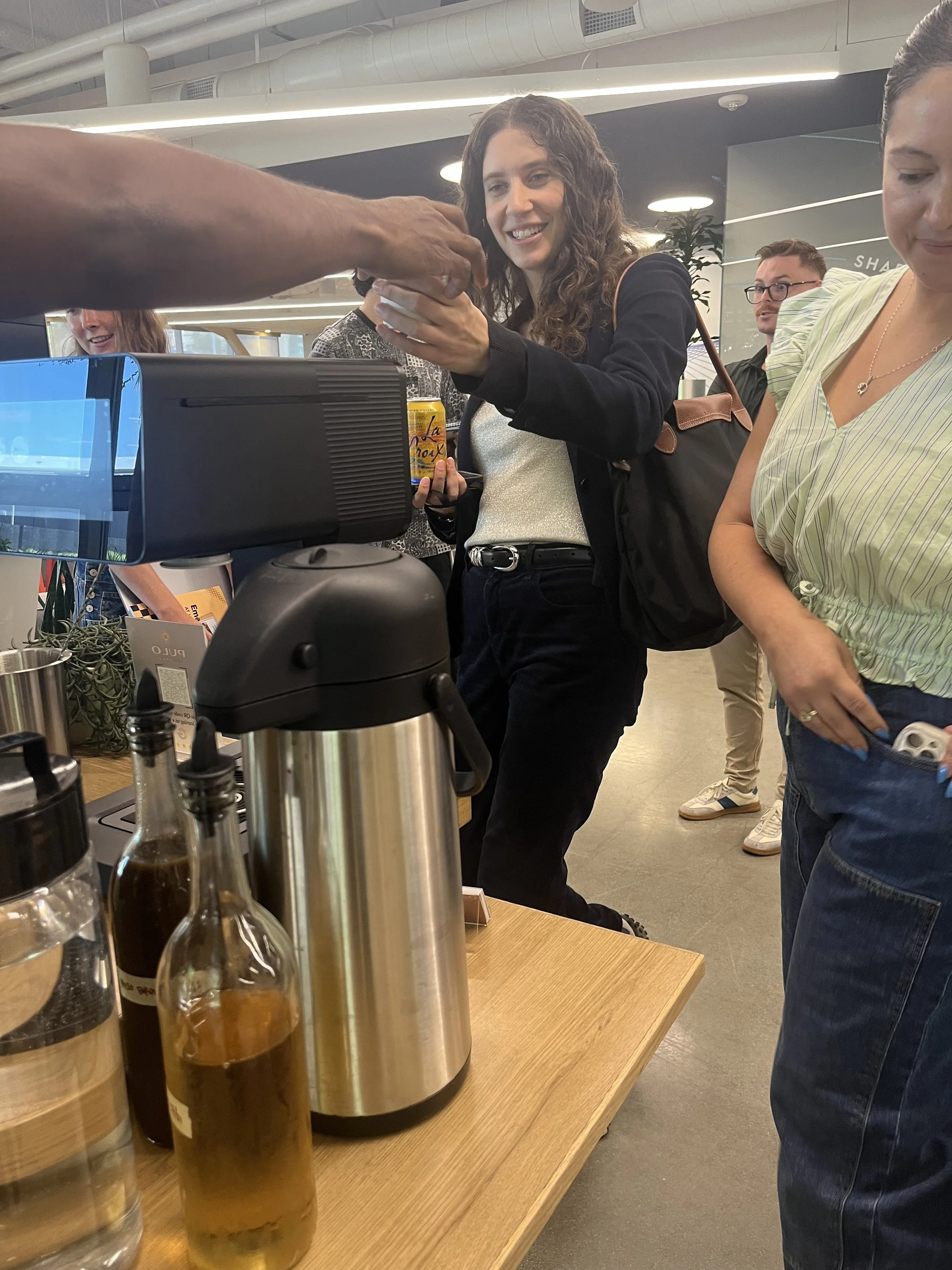 Guest receiving drink at Pulo Coffee branded coffee cart during PayPal Ads client event in Los Angeles