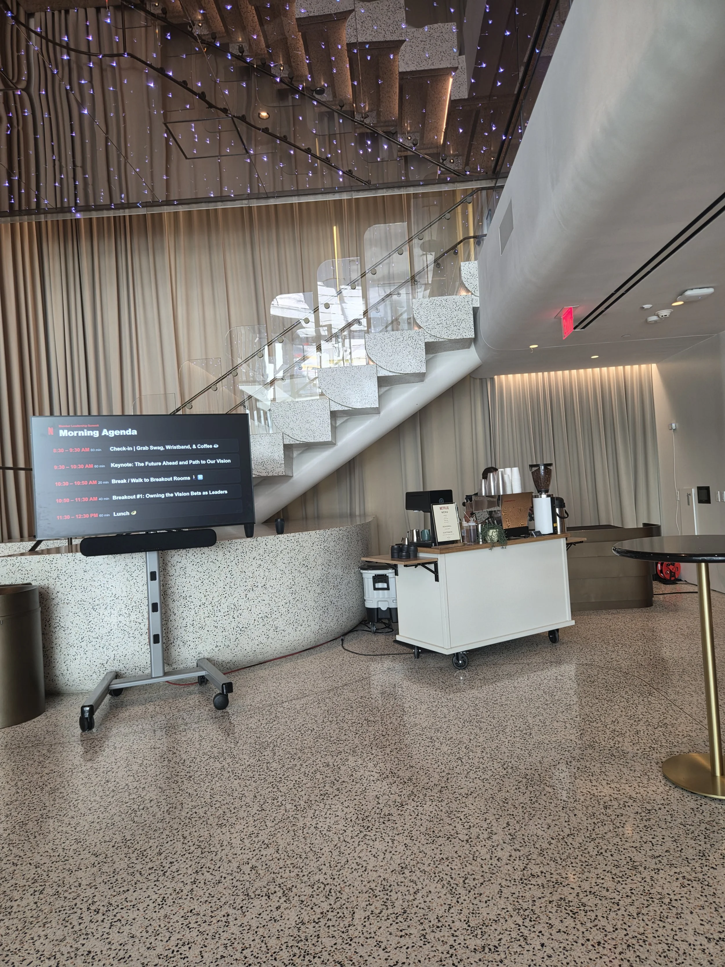 Pulo Coffee baristas at Netflix ERG Leadership Summit with branded menu and La Marzocco espresso bar