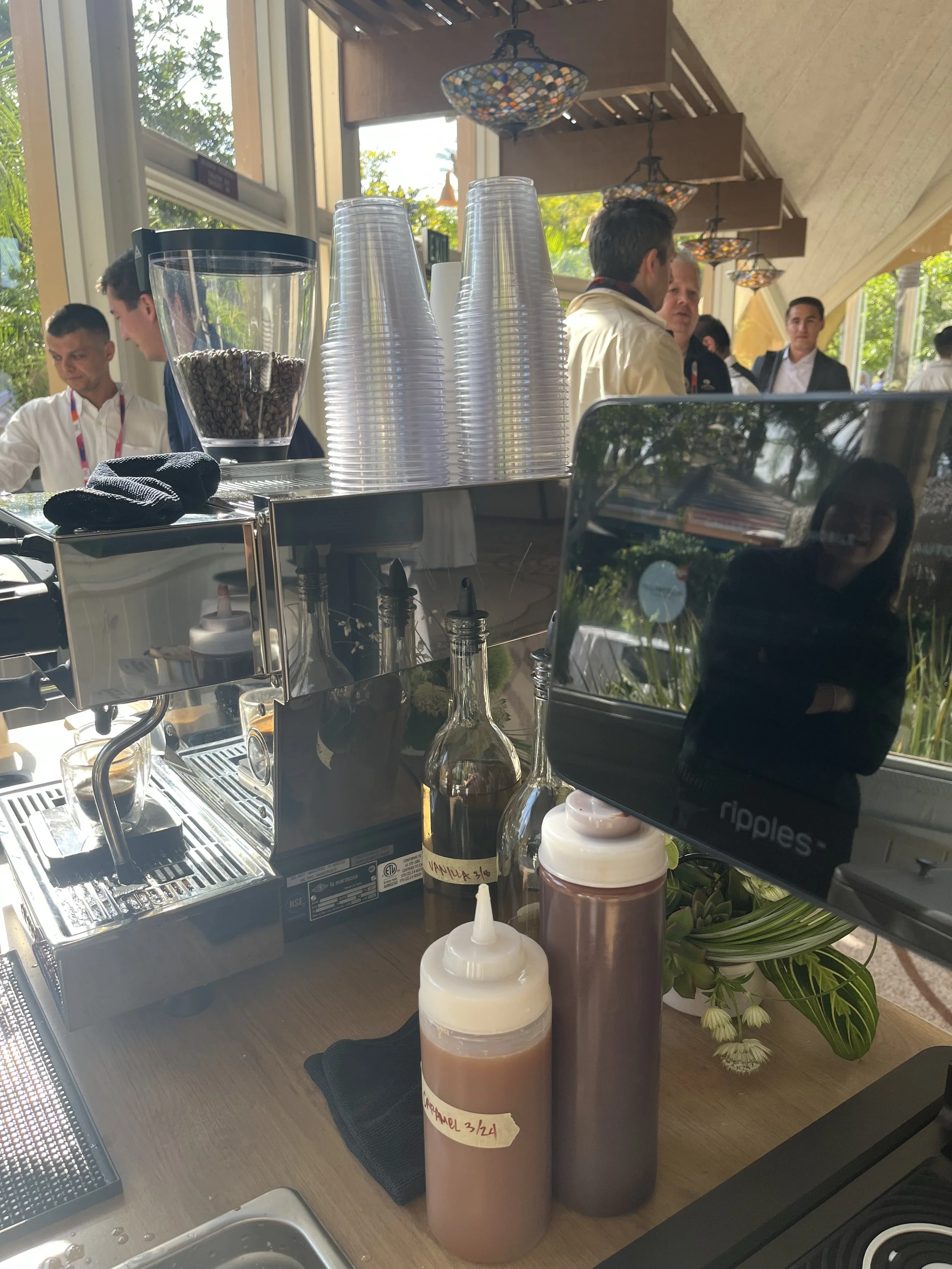 Mobile coffee cart setup with espresso machine and Ripple latte printer during corporate event coffee catering