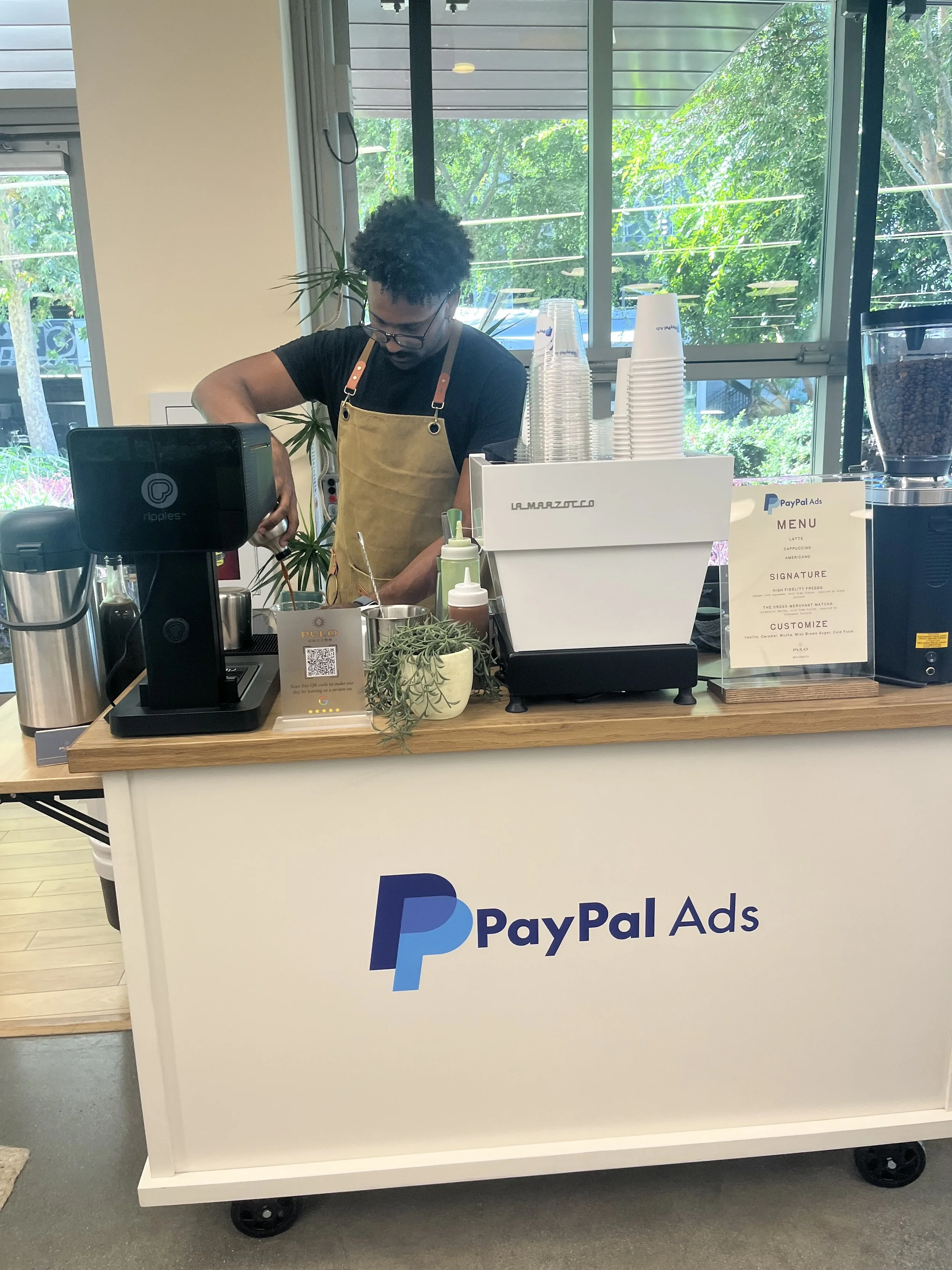 Pulo Coffee barista at PayPal Ads branded coffee cart with Ripples drink printer at Los Angeles corporate event