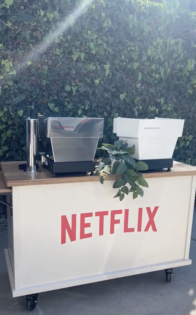 Custom branded coffee cart serving espresso drinks at a Netflix event