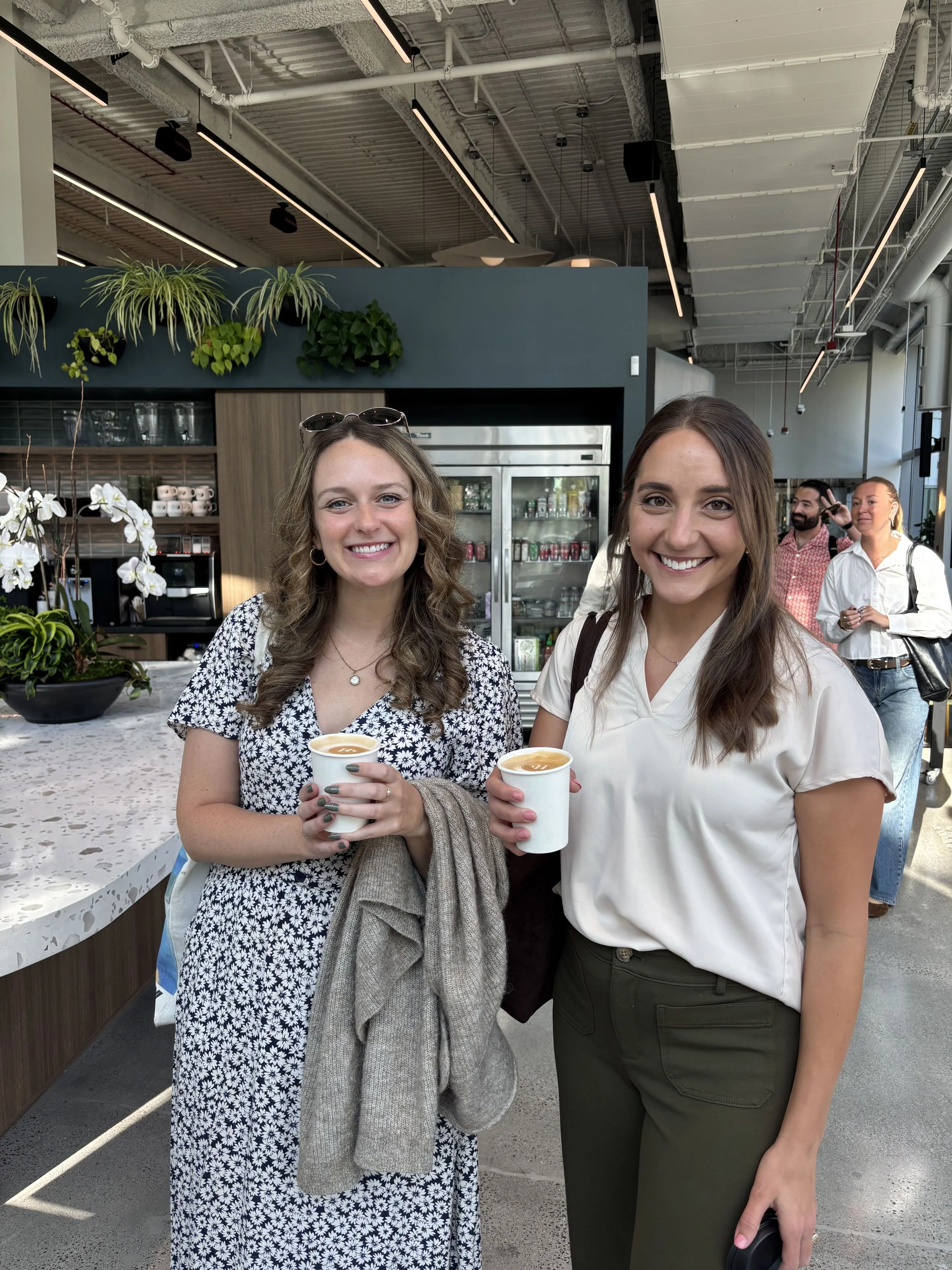 Guests smiling with Pulo Coffee lattes at Google corporate office event in Los Angeles