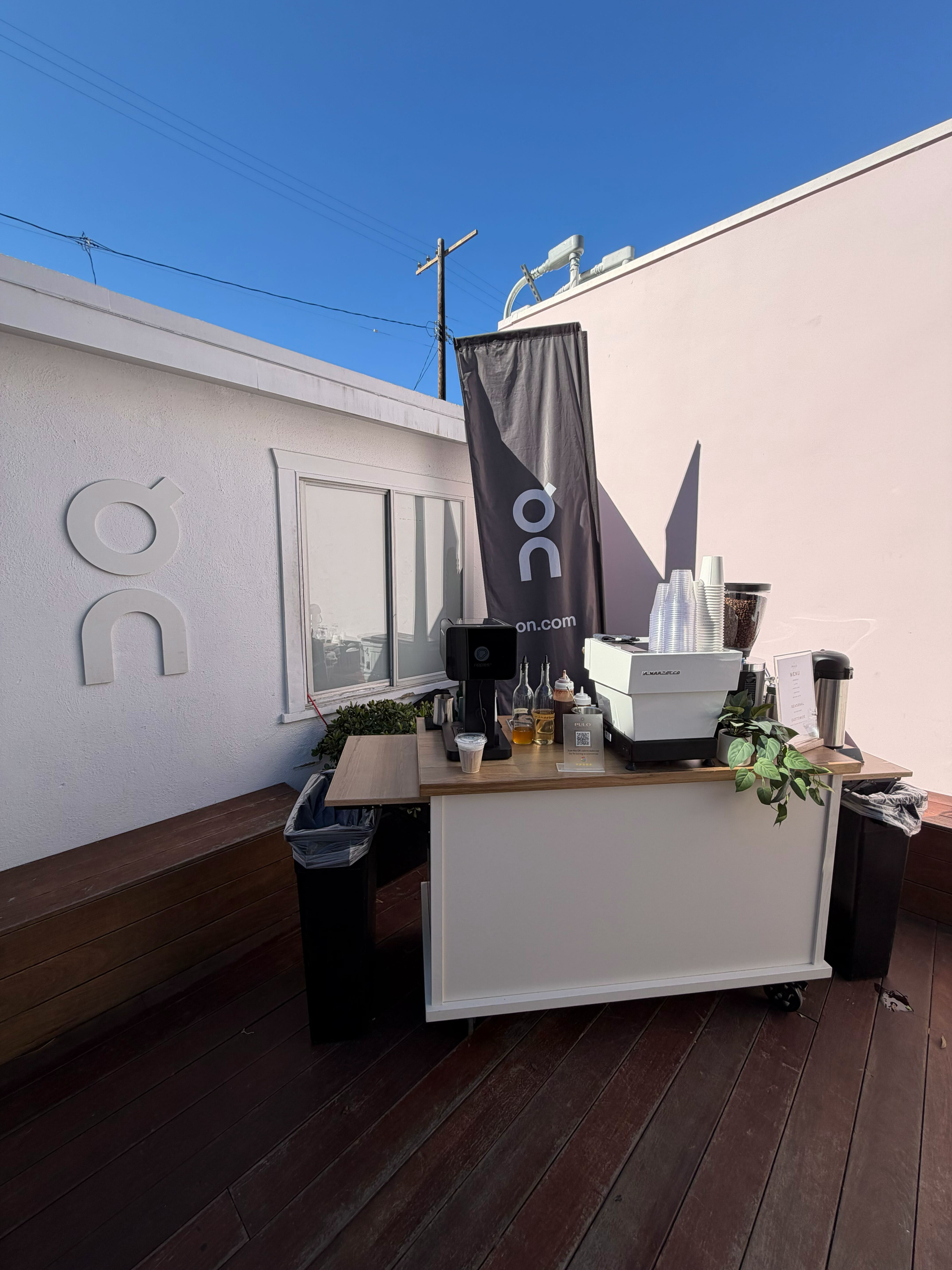 Barista preparing espresso drinks at a mobile coffee cart for brand activation catered events in LA