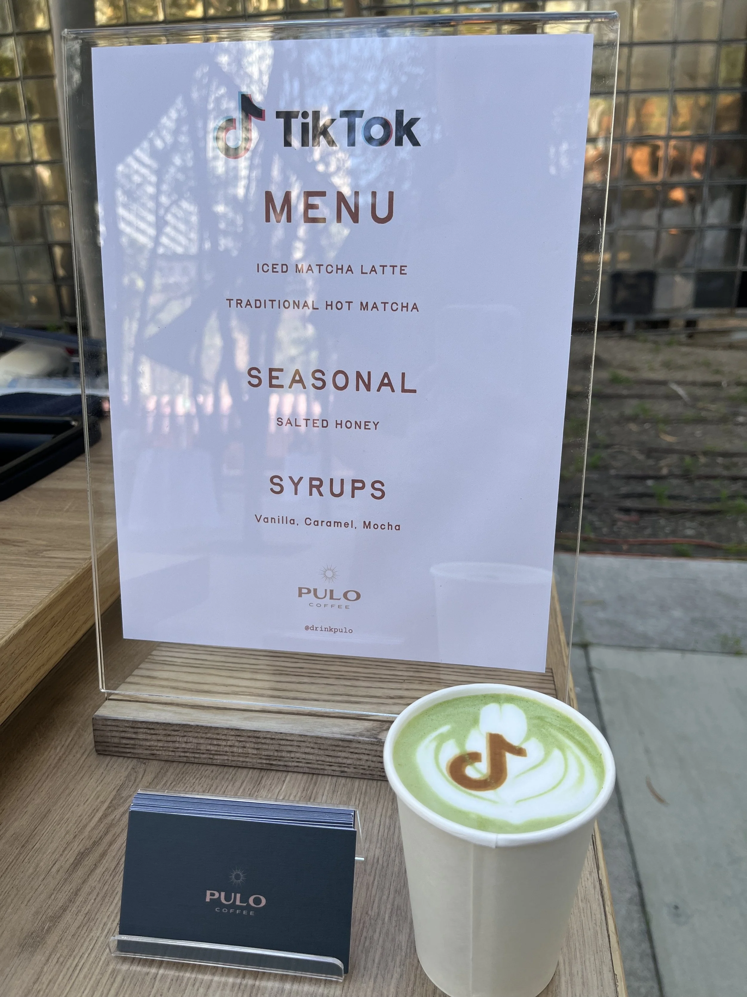 TikTok Shop Beauty Besties event branded matcha bar menu with custom TikTok latte art by Pulo Coffee in Los Angeles