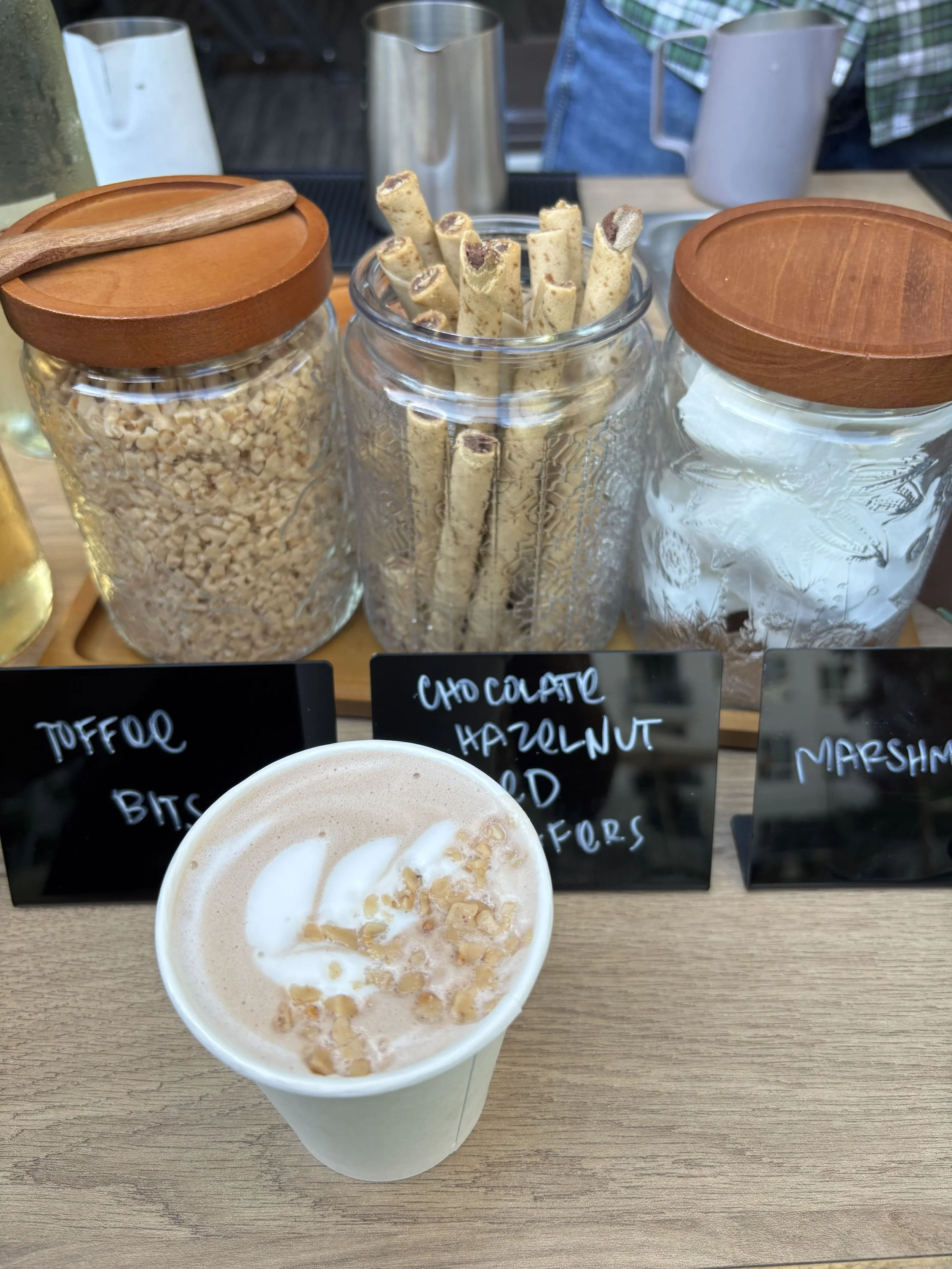 Hot chocolate with latte art and toffee bits from a Pulo Coffee mobile hot chocolate bar in Los Angeles